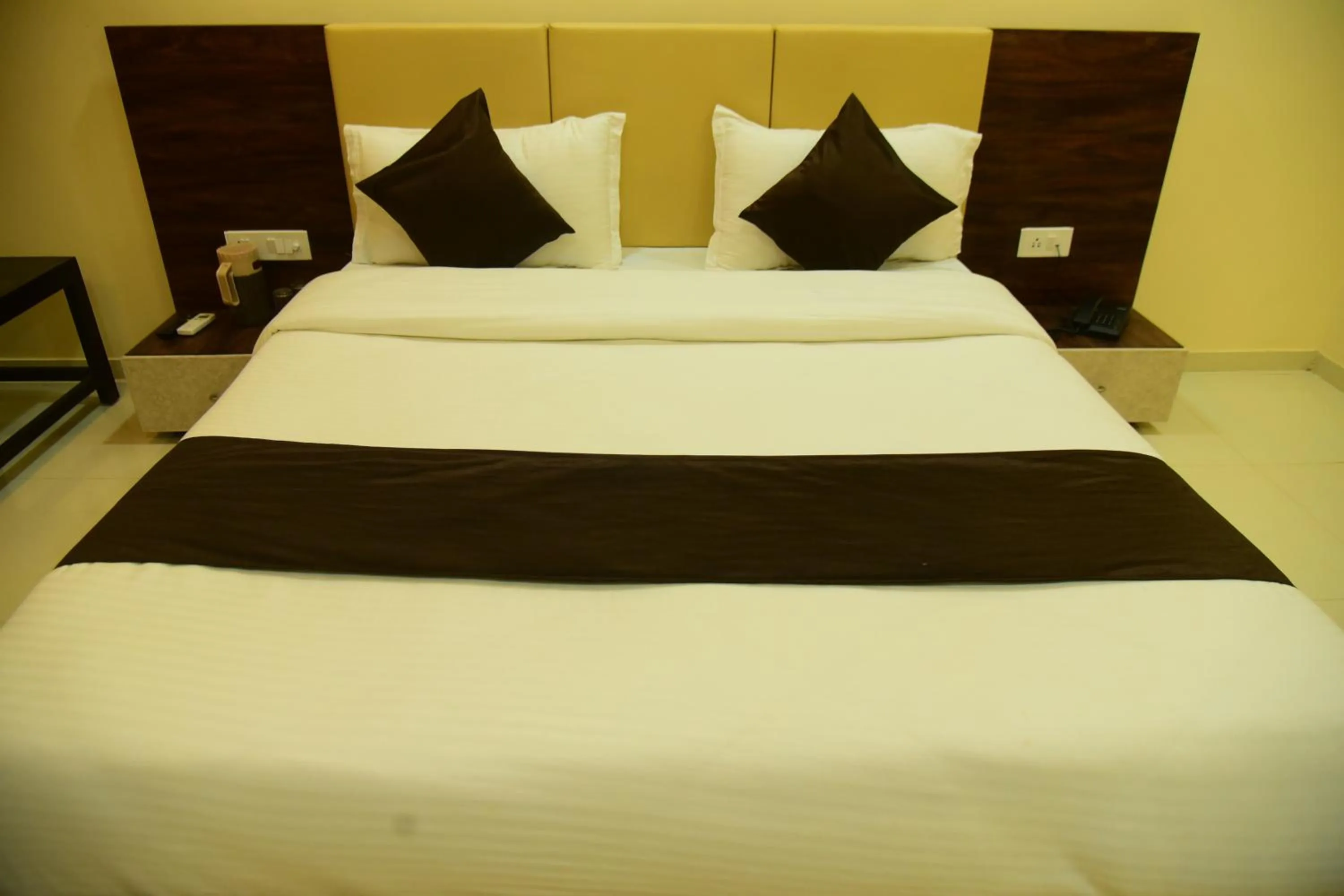 Bed in Hotel Savera Palace