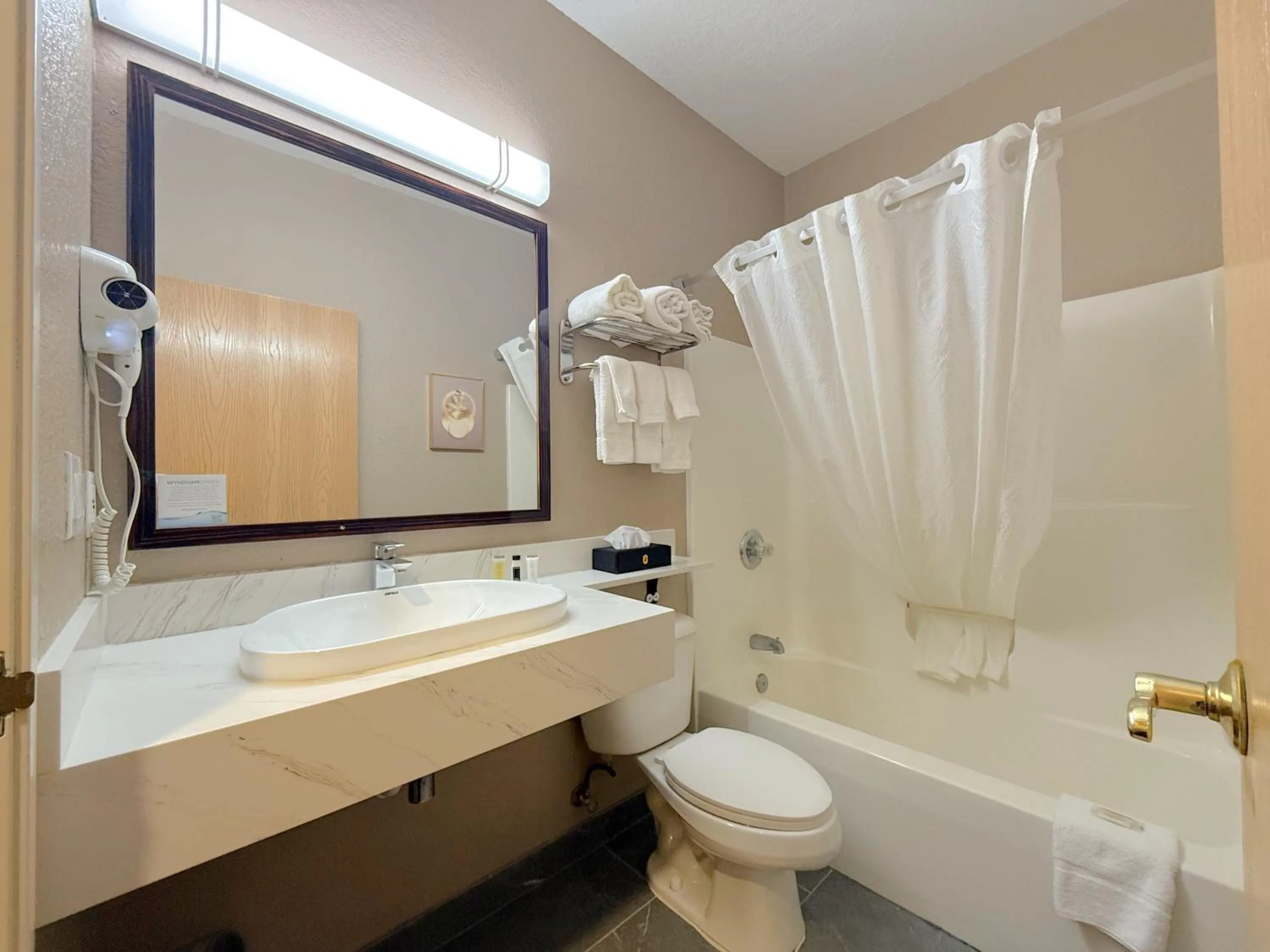 Bathroom in Super 8 by Wyndham Uniontown PA