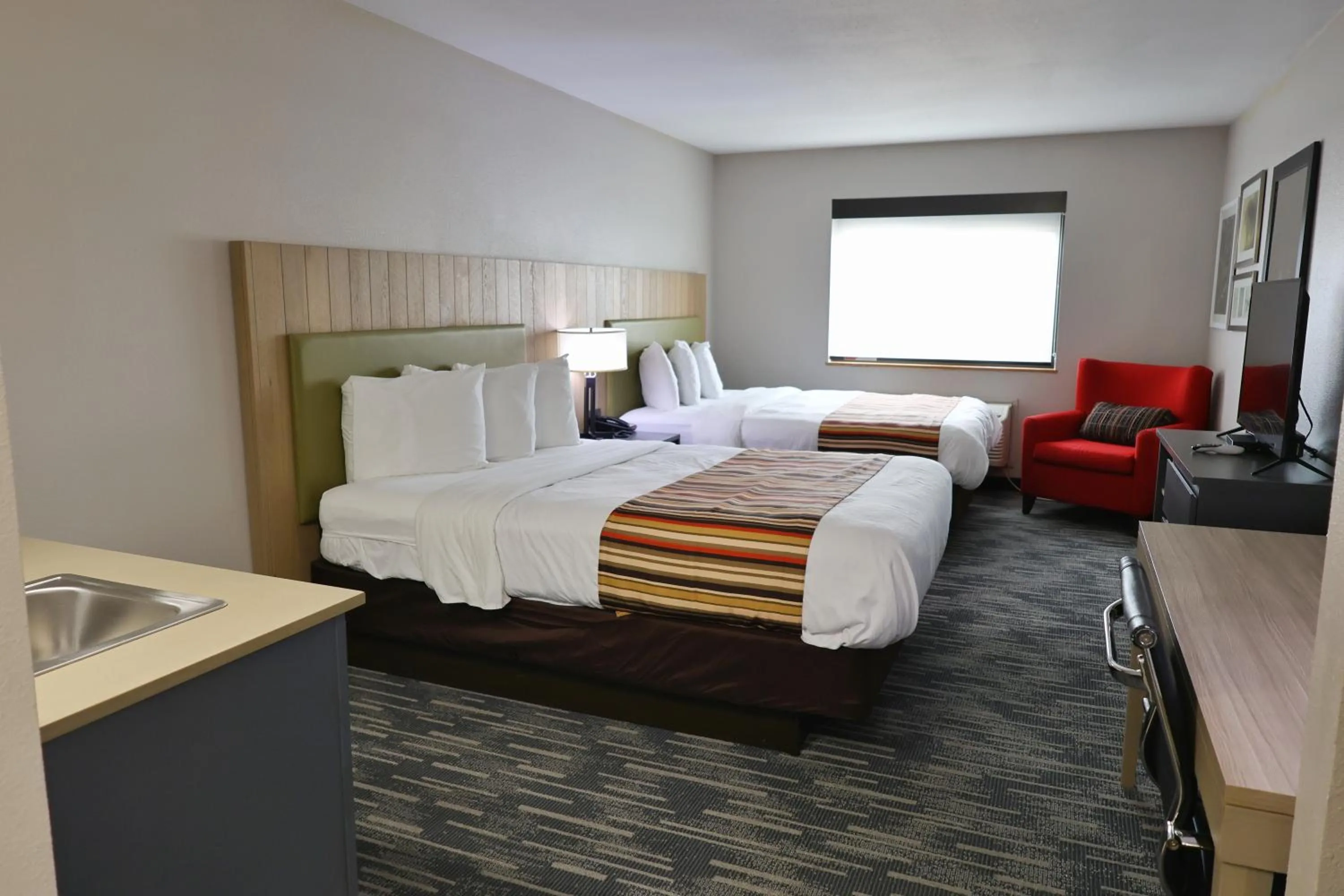 Bed in Country Inn & Suites by Radisson, Sparta, WI