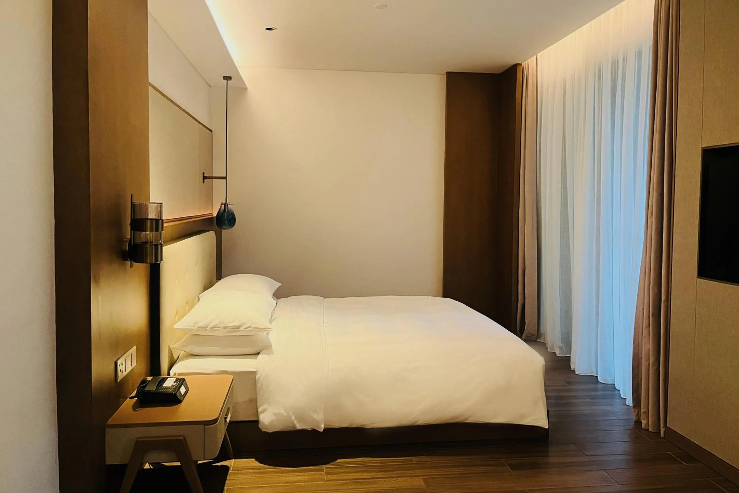 Bed in Wingate by Wyndham Hainan Chengmai