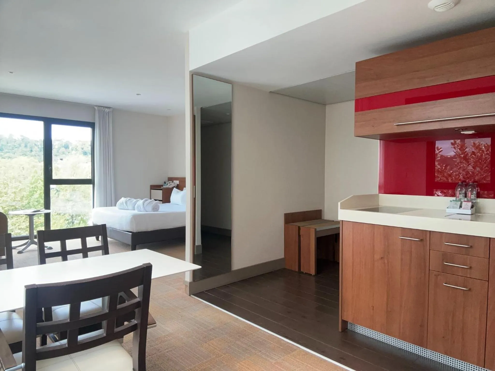 Kitchen or kitchenette, Bed in Hôtel Lyon Métropole & Spa