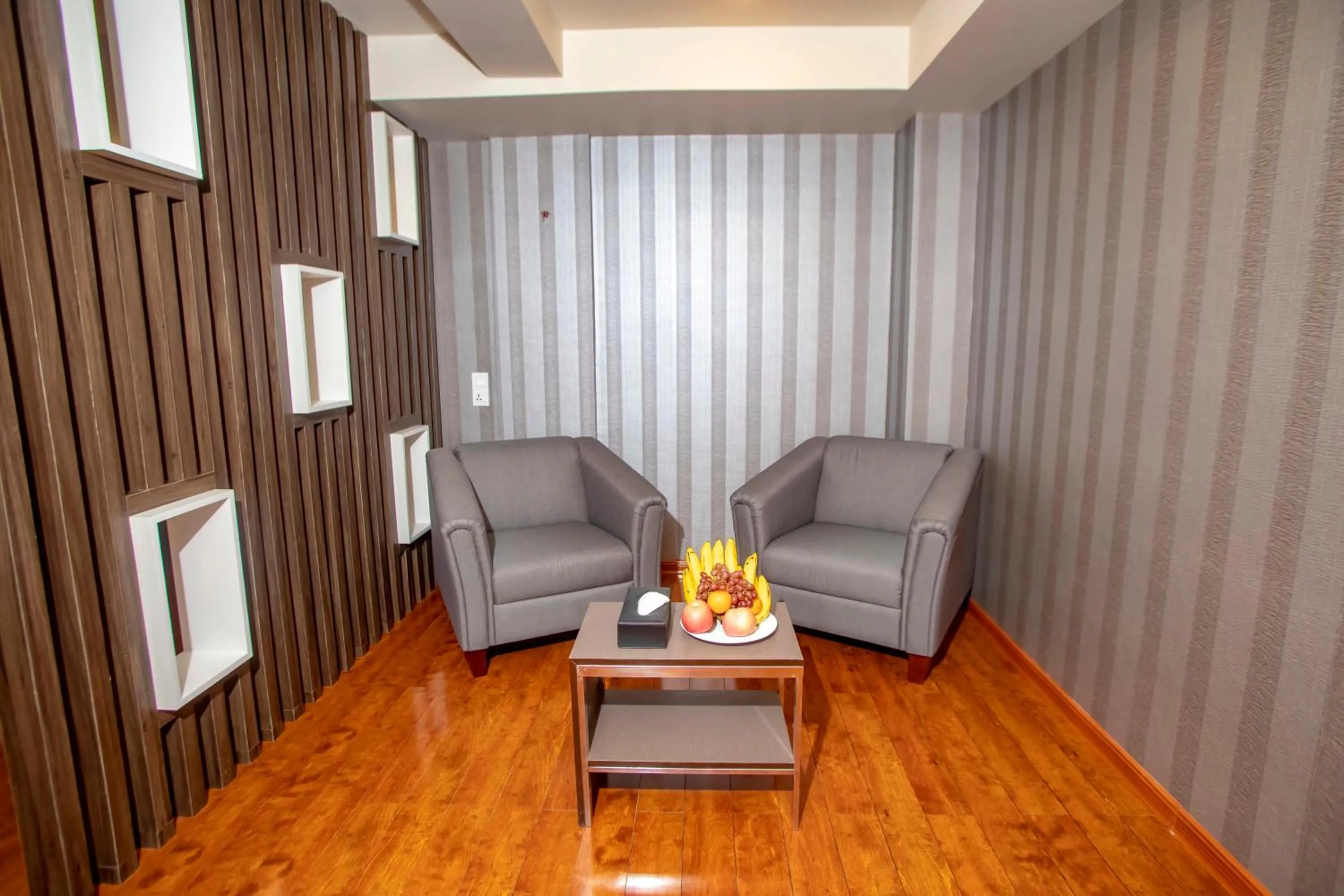 Seating area in Prestige Residences at Golden Valley by Grand United Hospitality