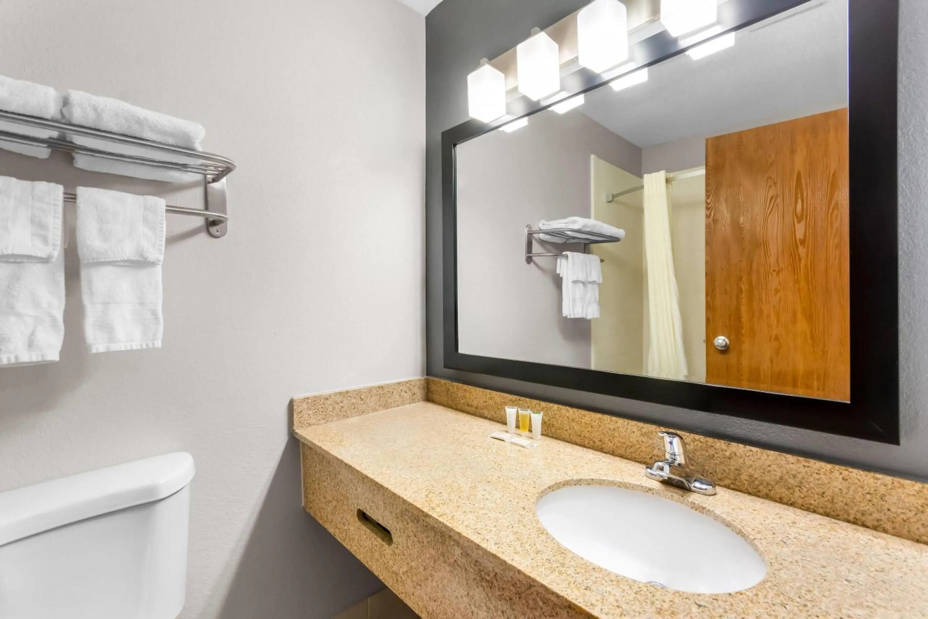 Bathroom in Super 8 by Wyndham Bloomington University Area