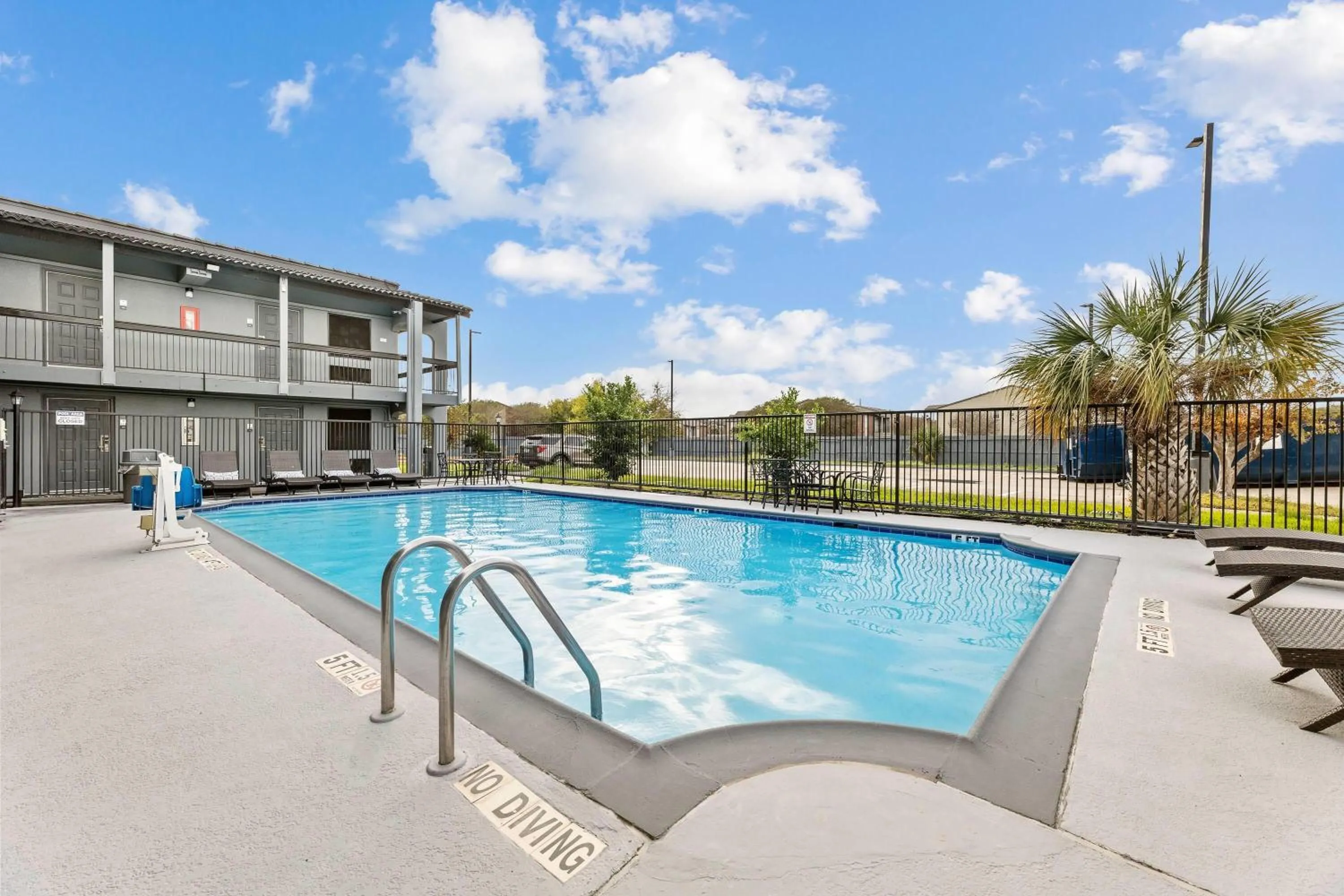 Pool view in Days Inn & Suites by Wyndham Texas City
