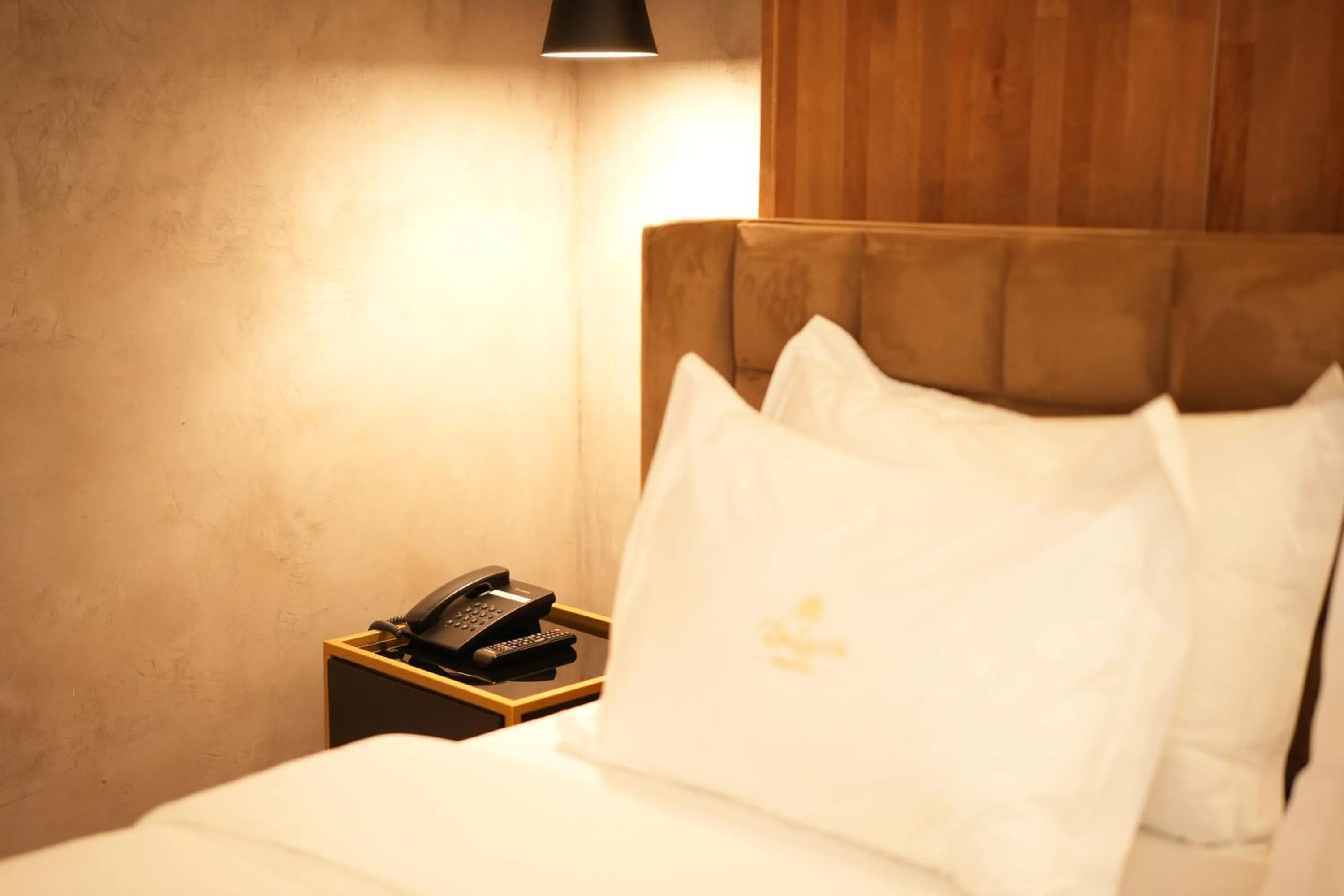 Bed in La Suite Boutique Hotel