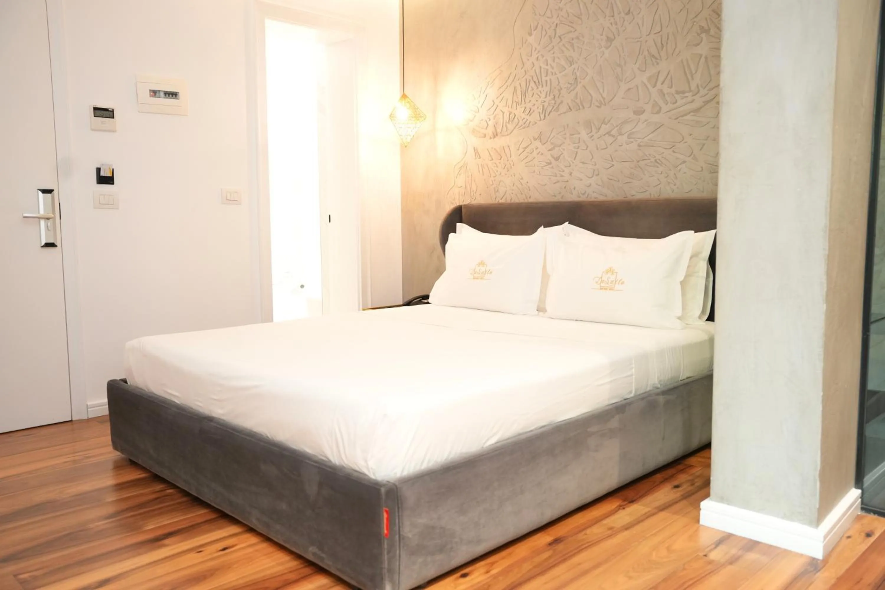 Bed in La Suite Boutique Hotel