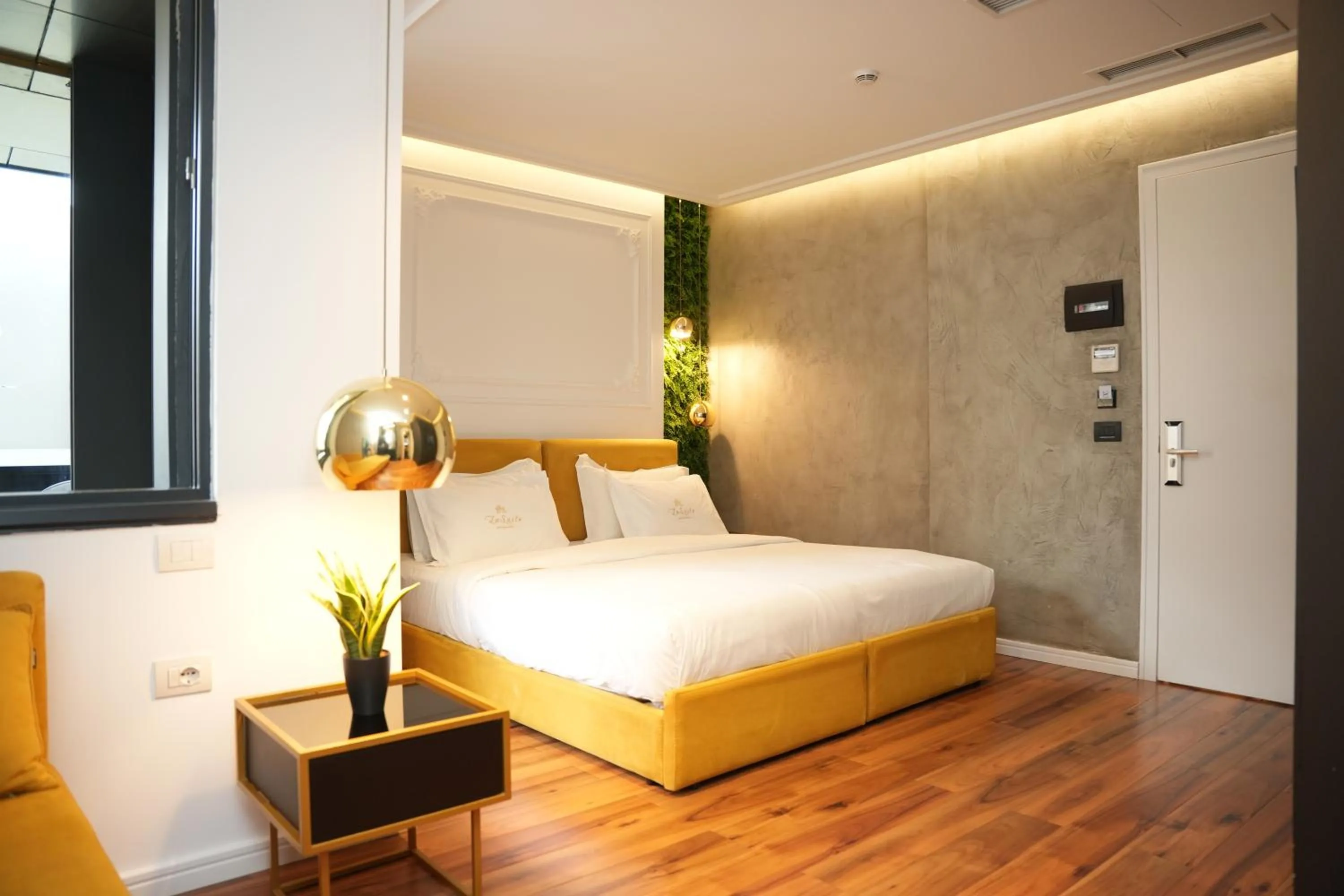 Bed in La Suite Boutique Hotel