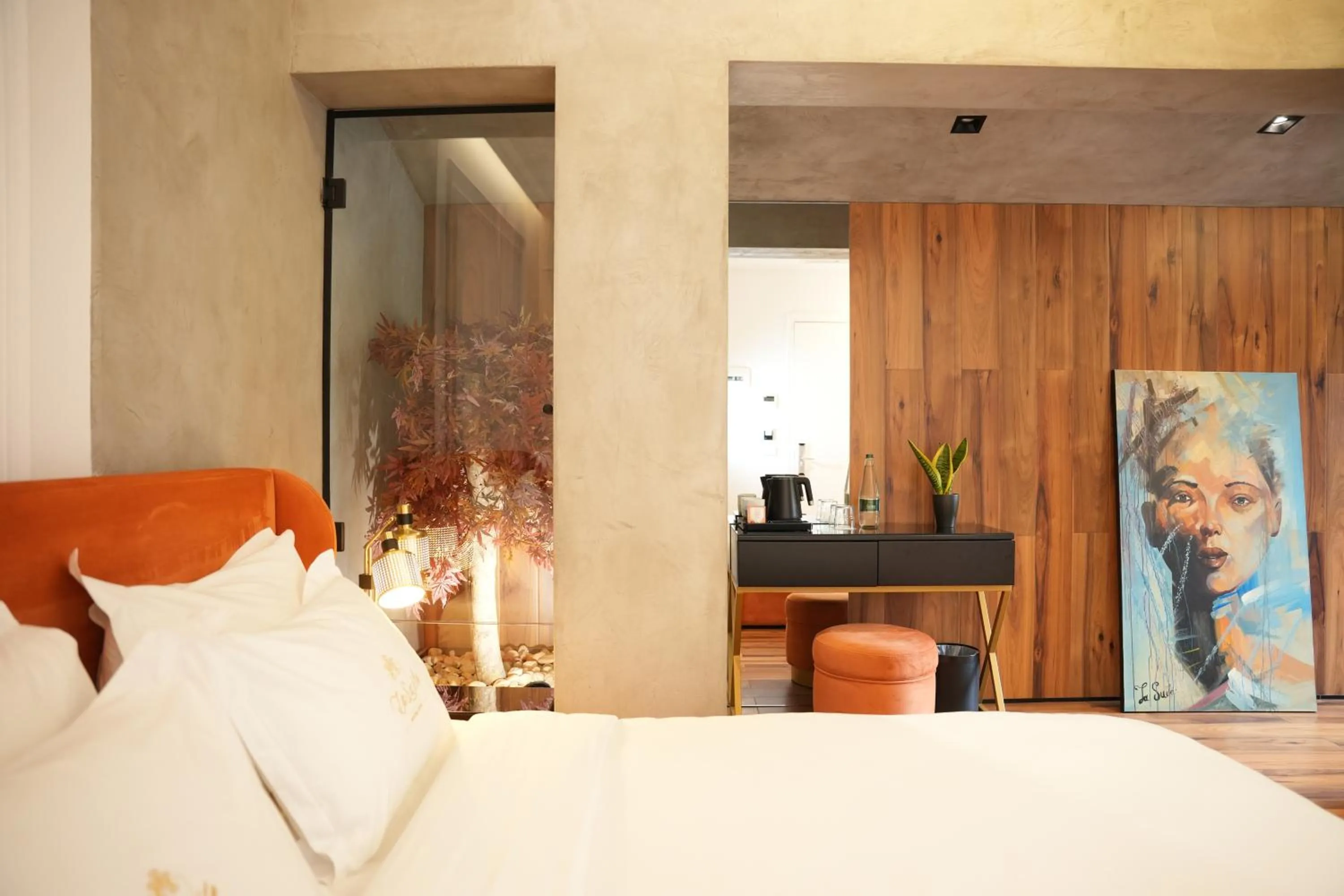 Bed in La Suite Boutique Hotel