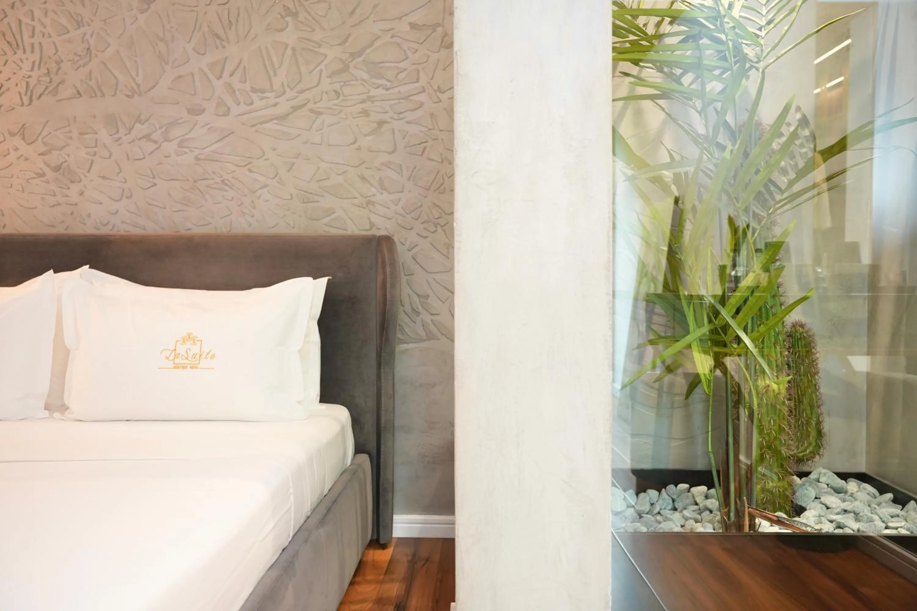 Bed in La Suite Boutique Hotel