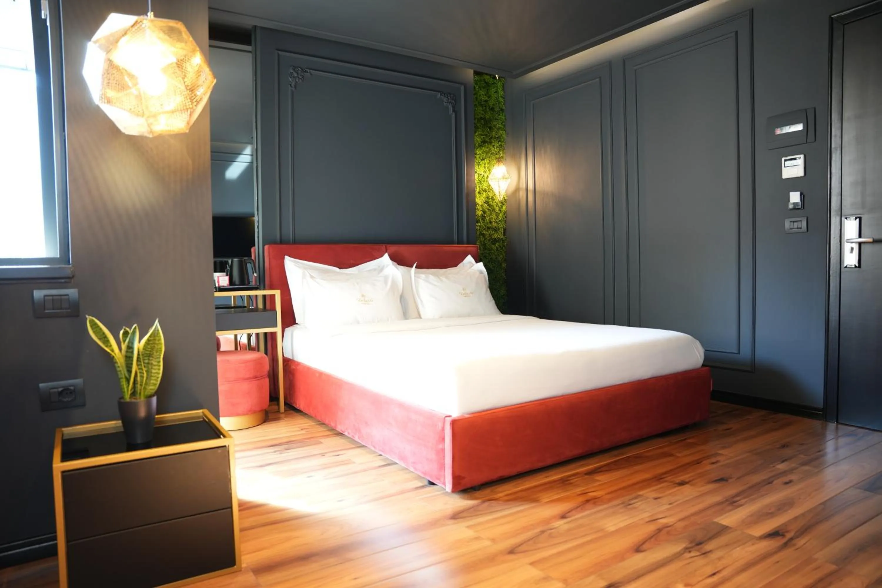 Bed in La Suite Boutique Hotel