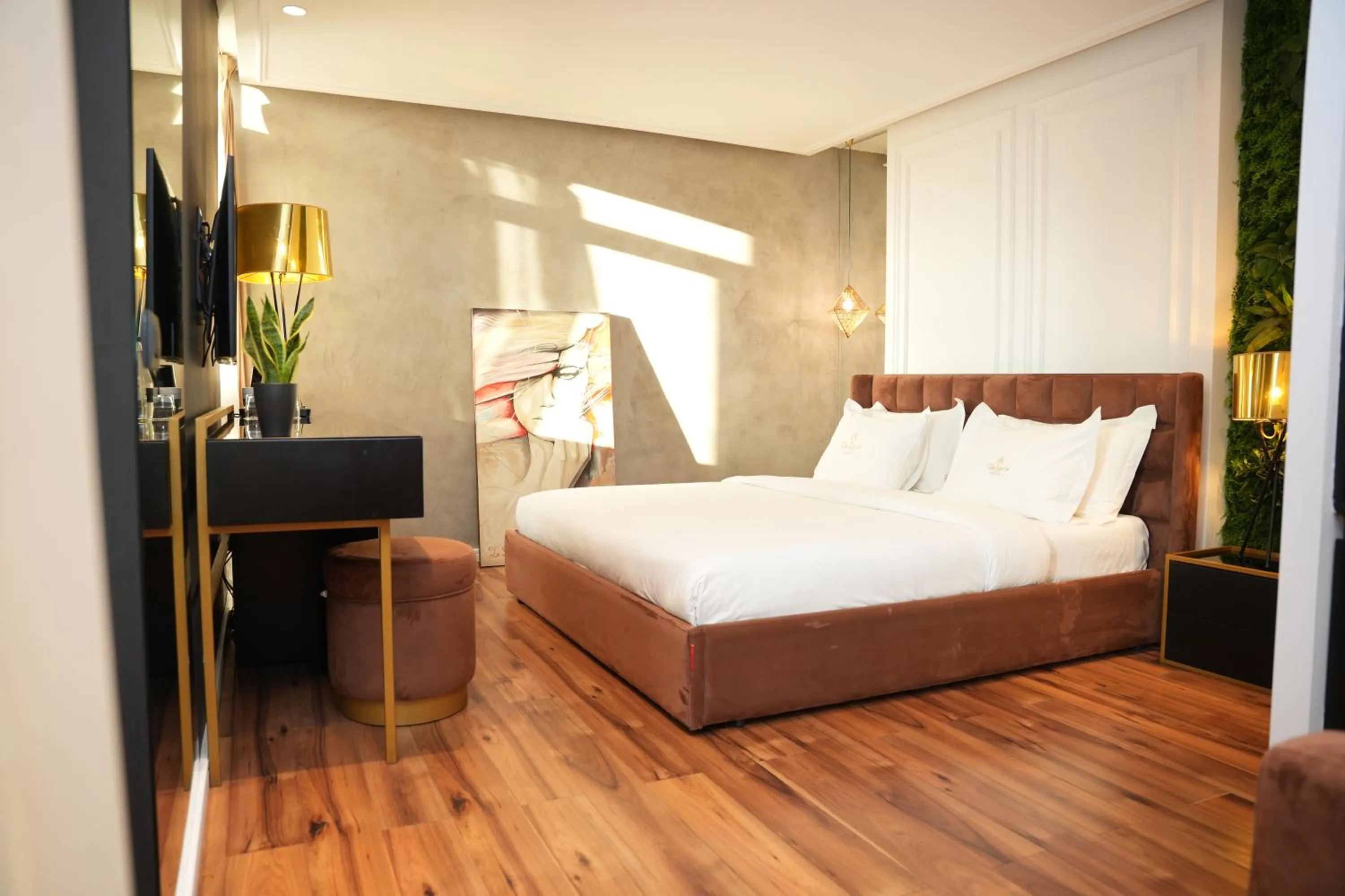 Bed in La Suite Boutique Hotel