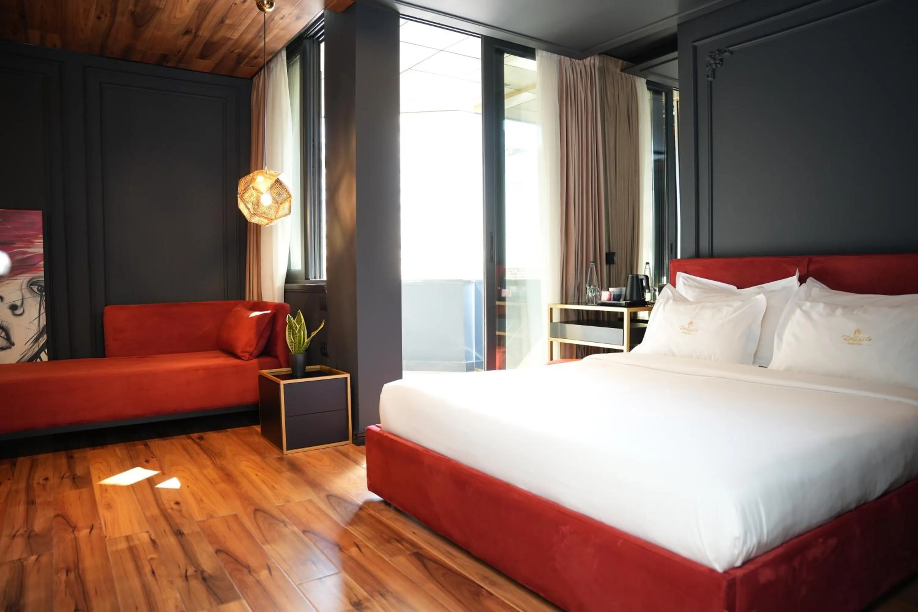 Bed in La Suite Boutique Hotel