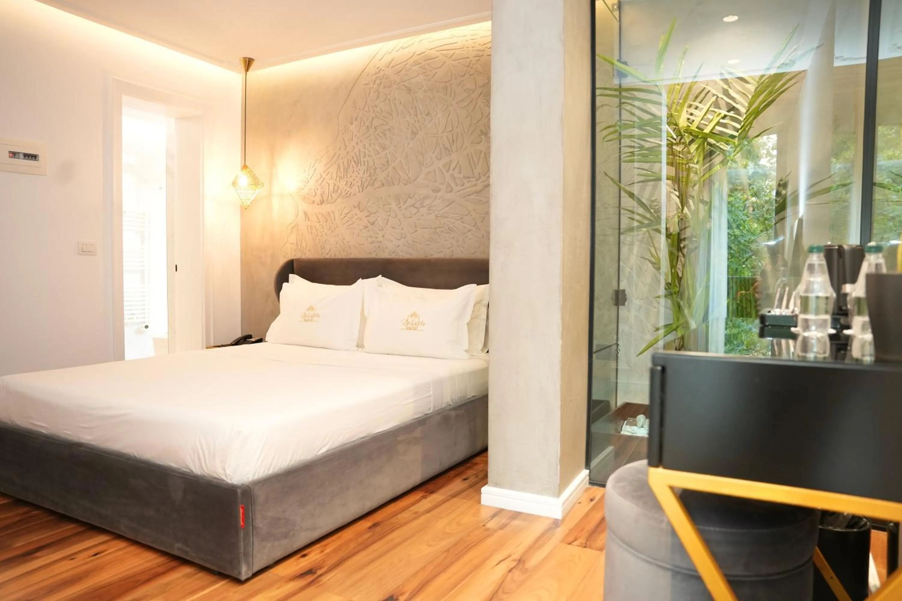 Bed in La Suite Boutique Hotel