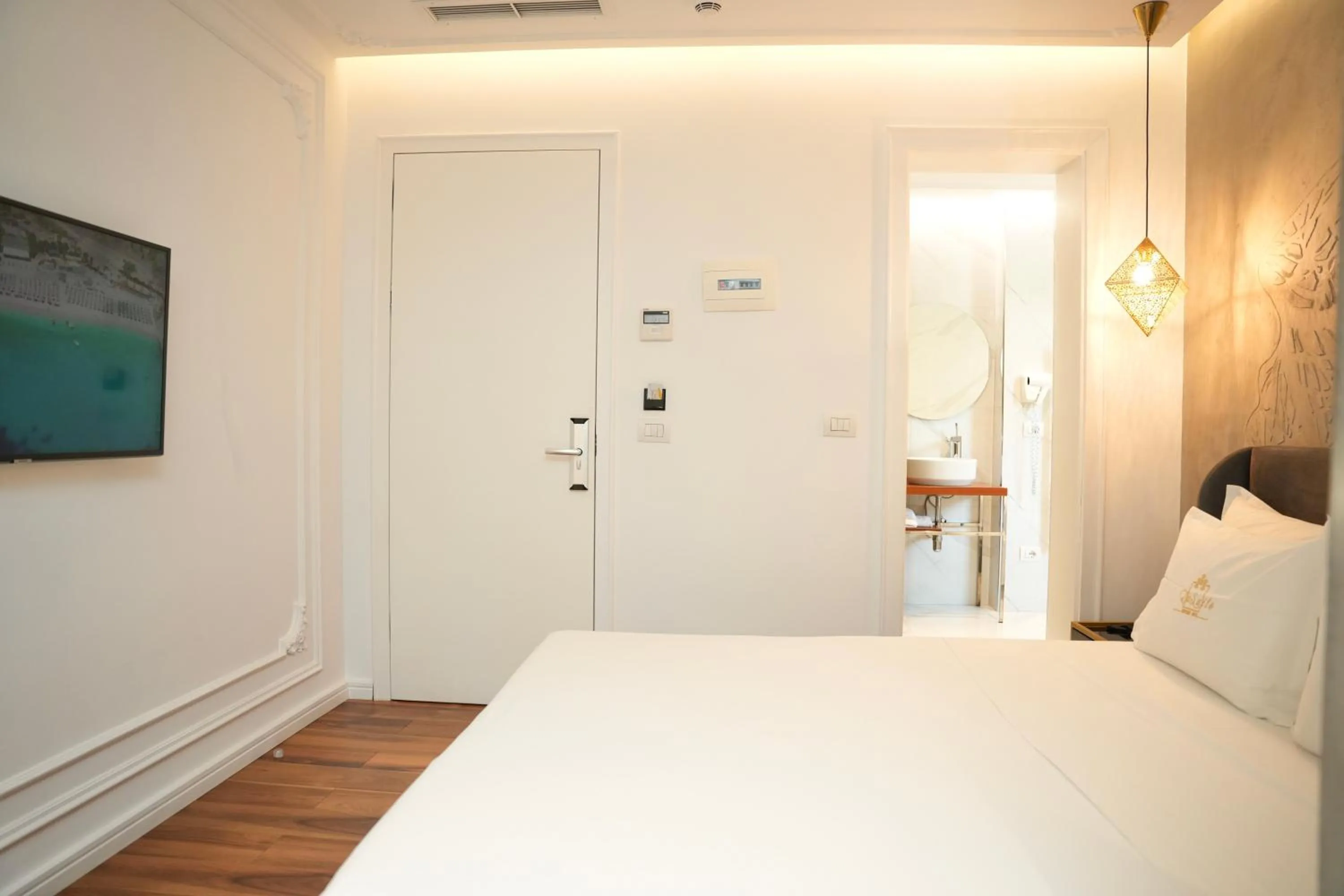 Bed in La Suite Boutique Hotel