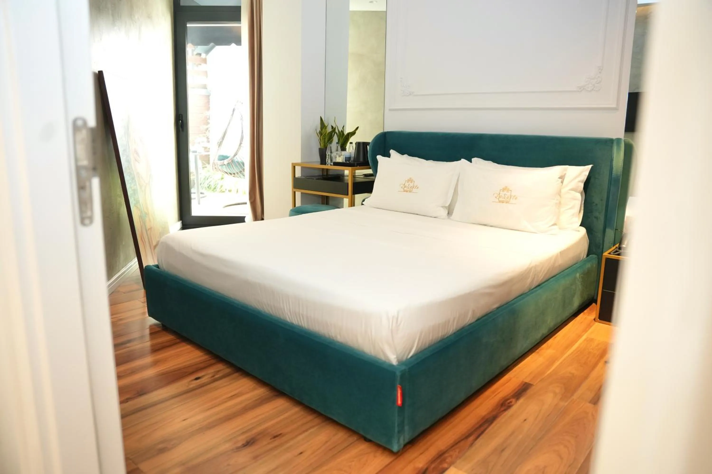 Bed in La Suite Boutique Hotel