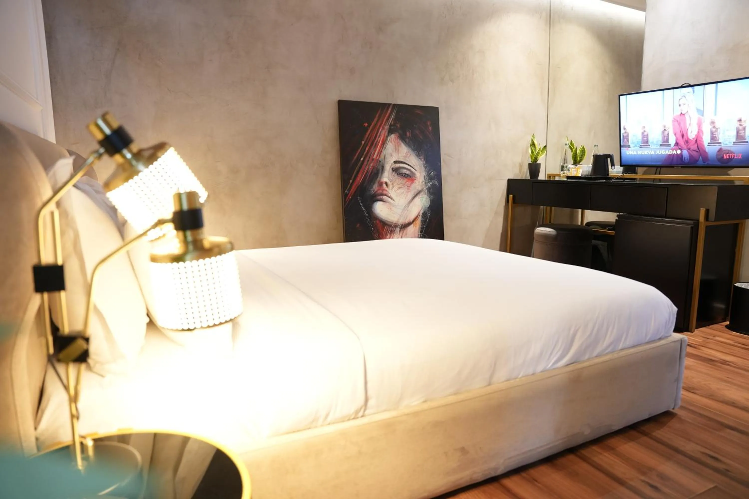 Bed in La Suite Boutique Hotel