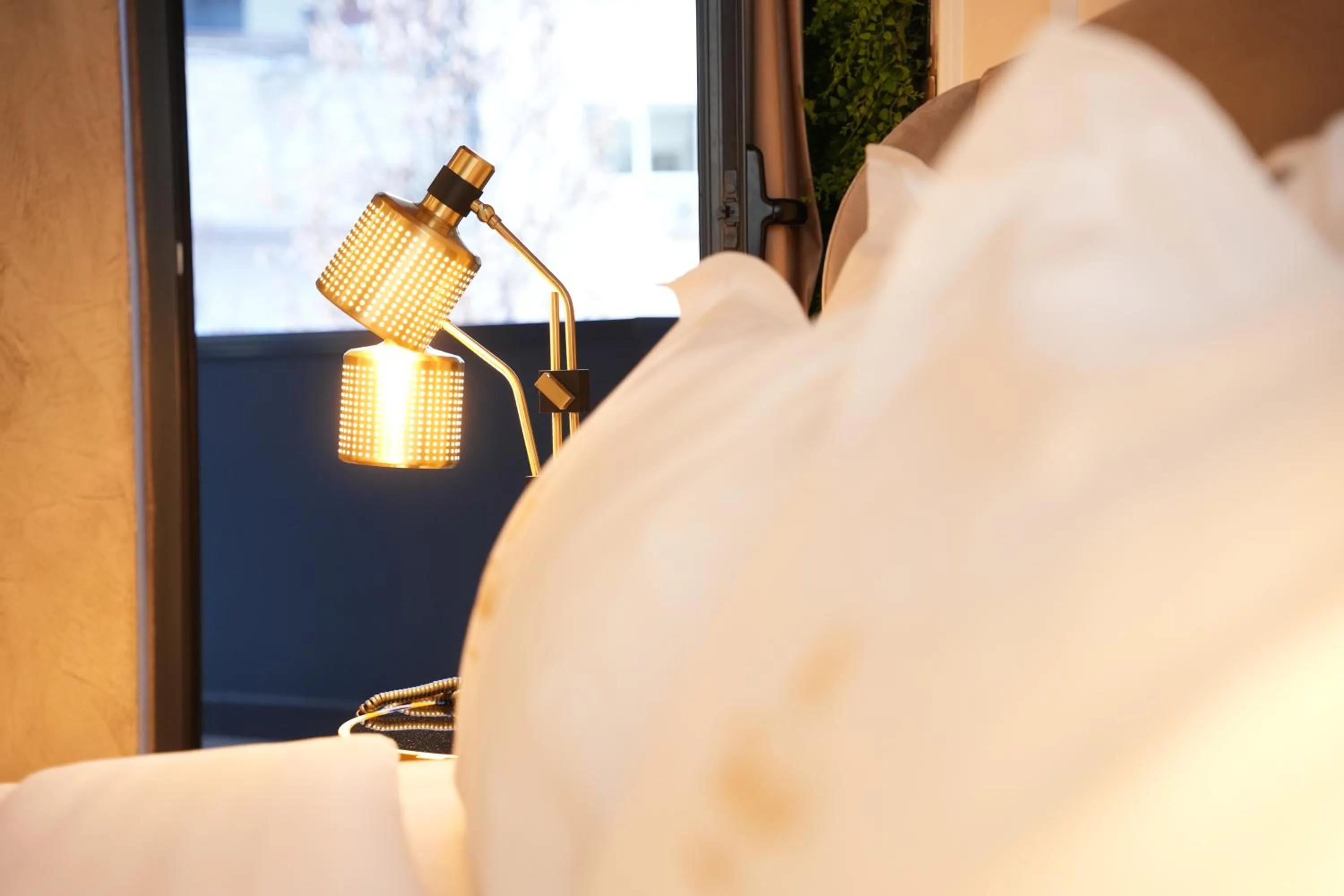 Bed in La Suite Boutique Hotel