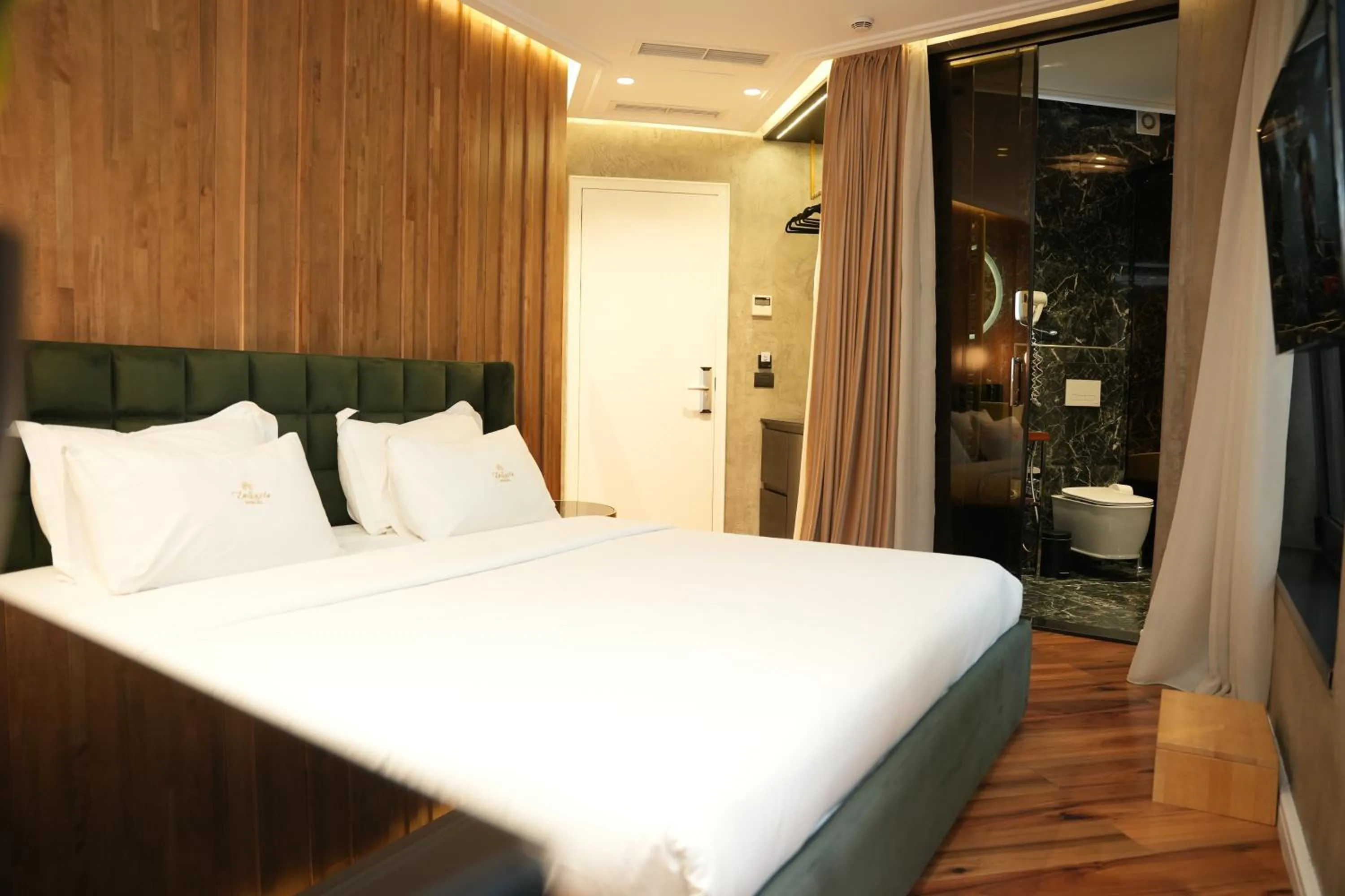 Bed in La Suite Boutique Hotel