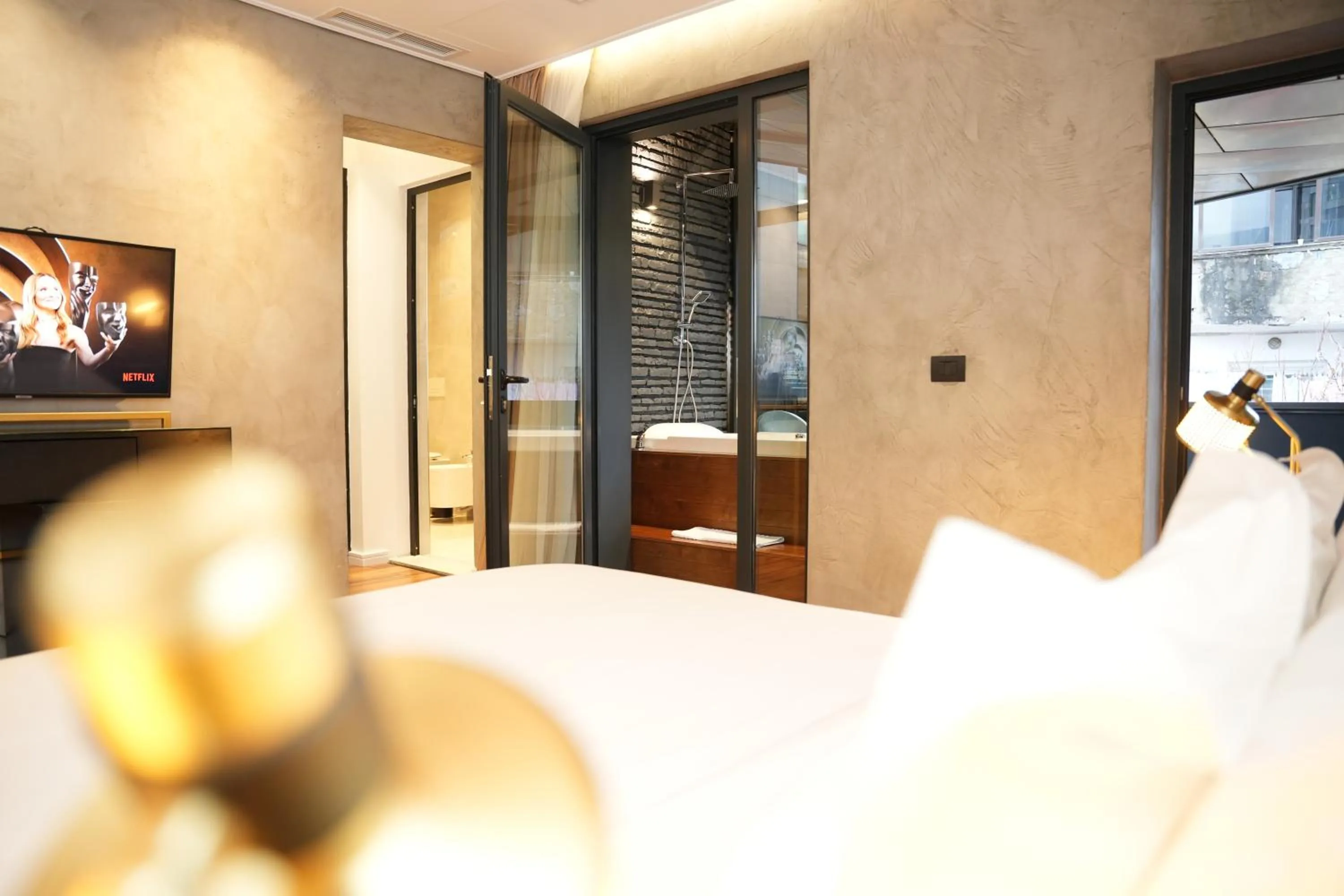 Bed in La Suite Boutique Hotel