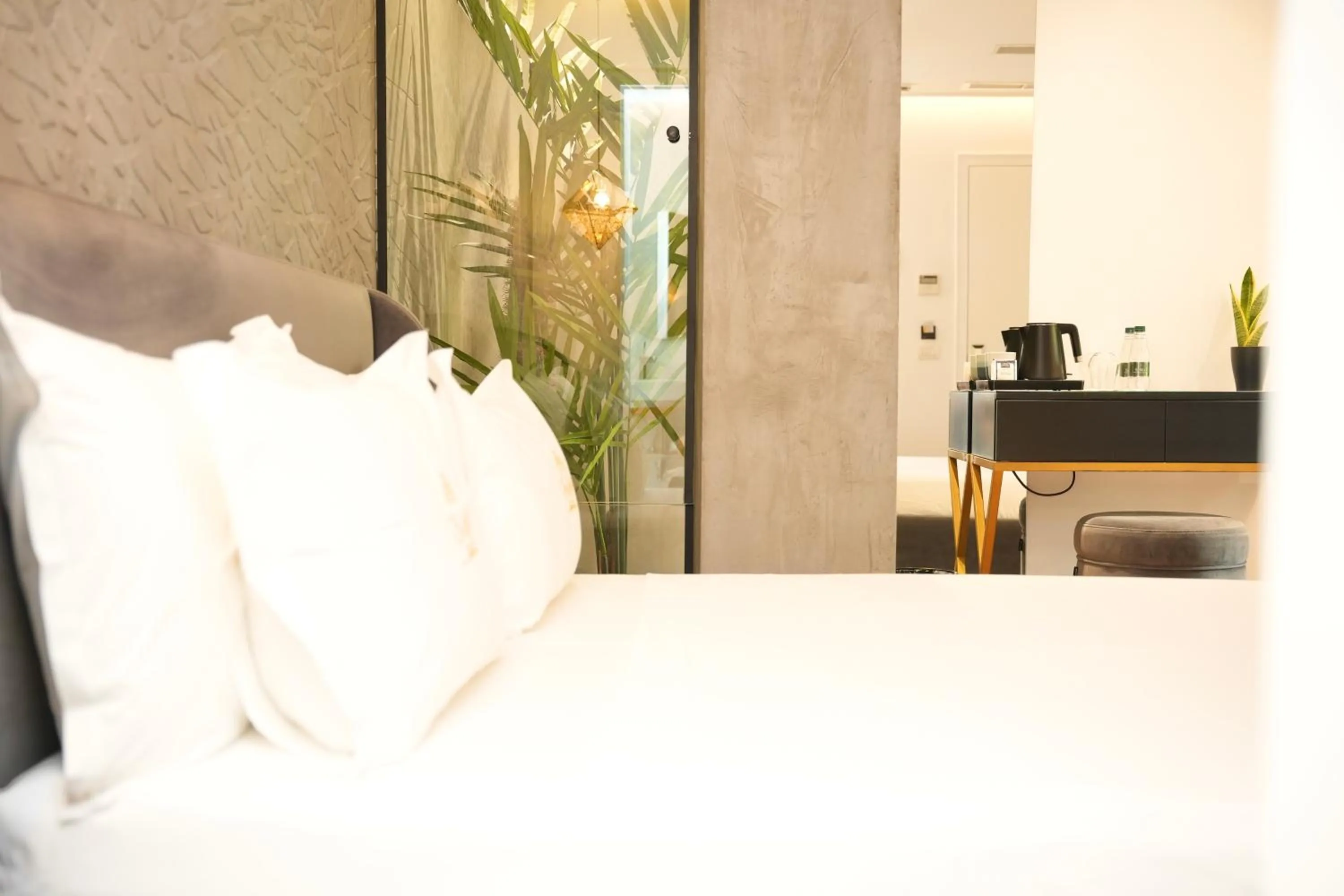 Bed in La Suite Boutique Hotel