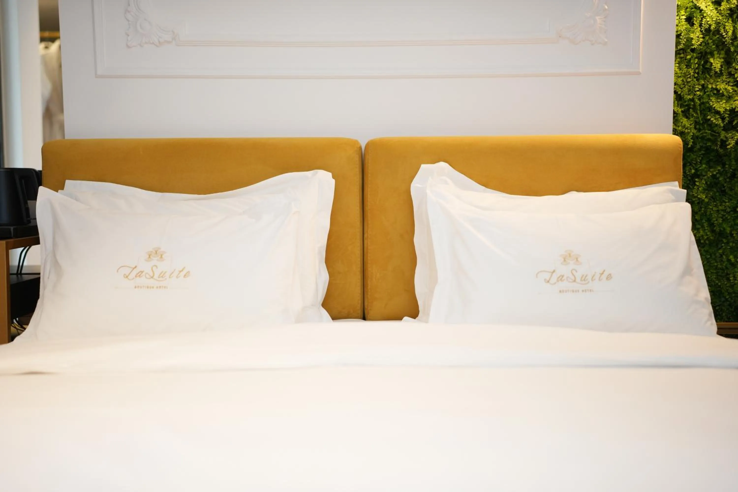 Bed in La Suite Boutique Hotel