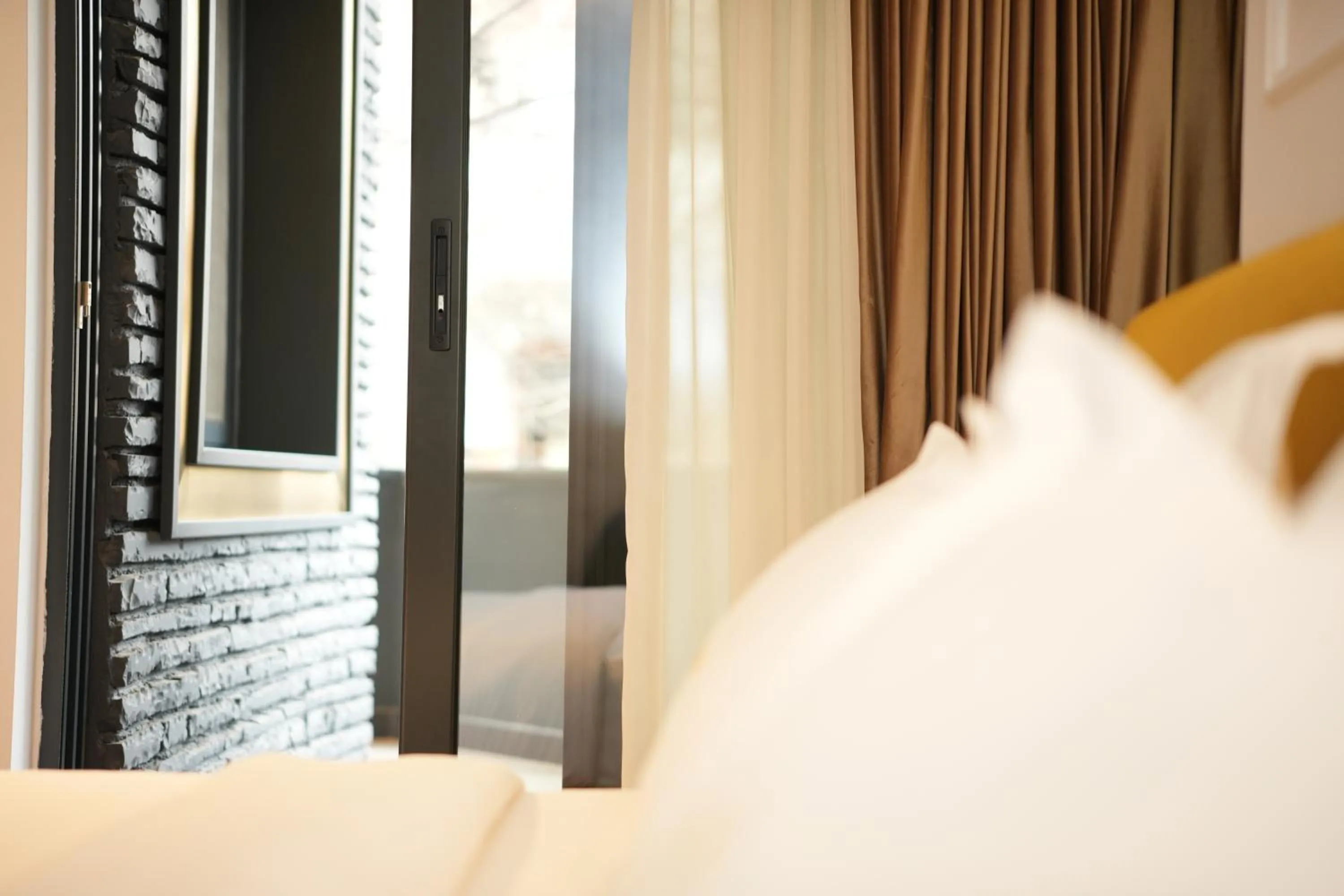 Bed in La Suite Boutique Hotel