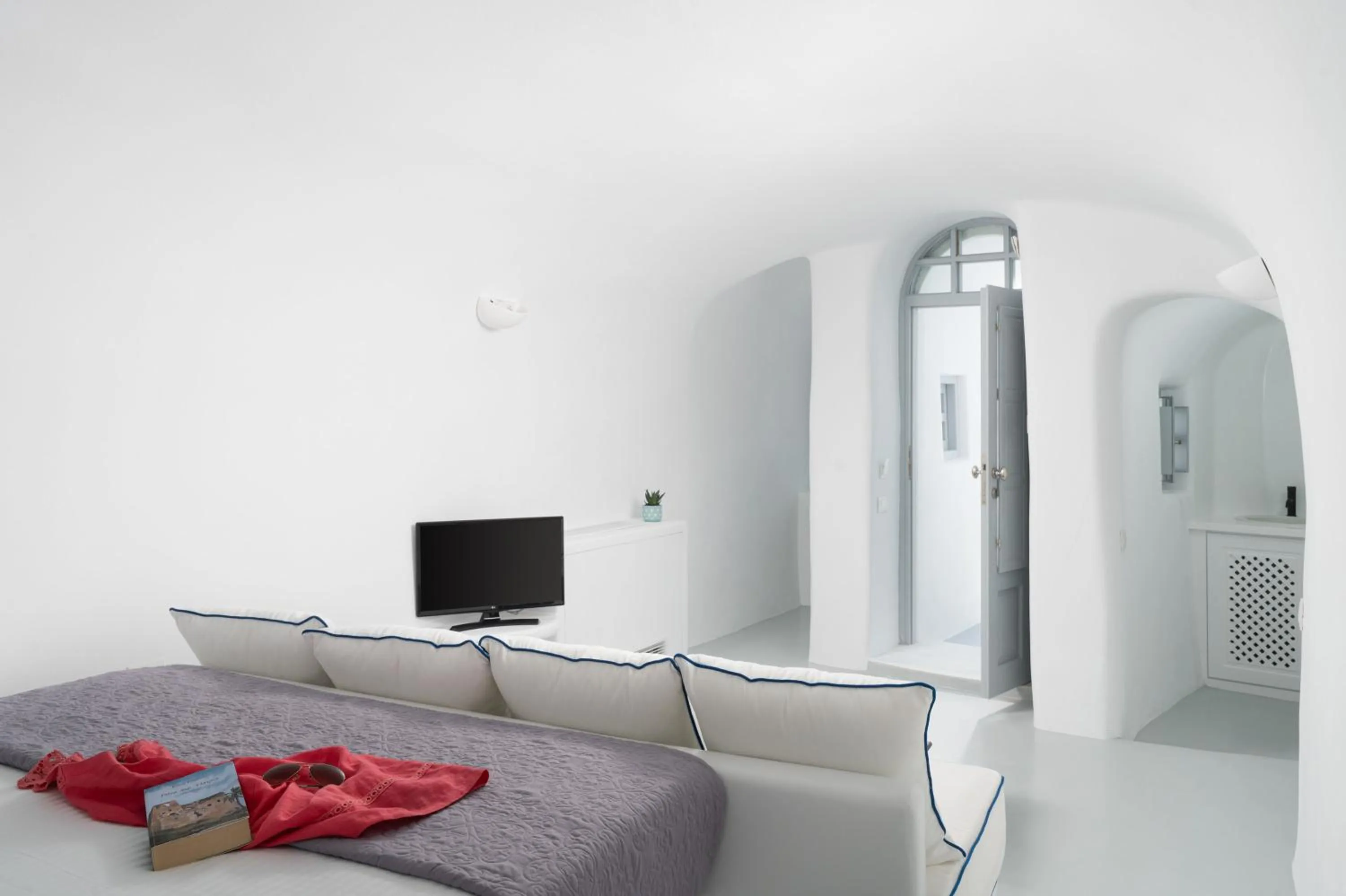 Seating area, Bed in Oia Spirit Boutique Residences