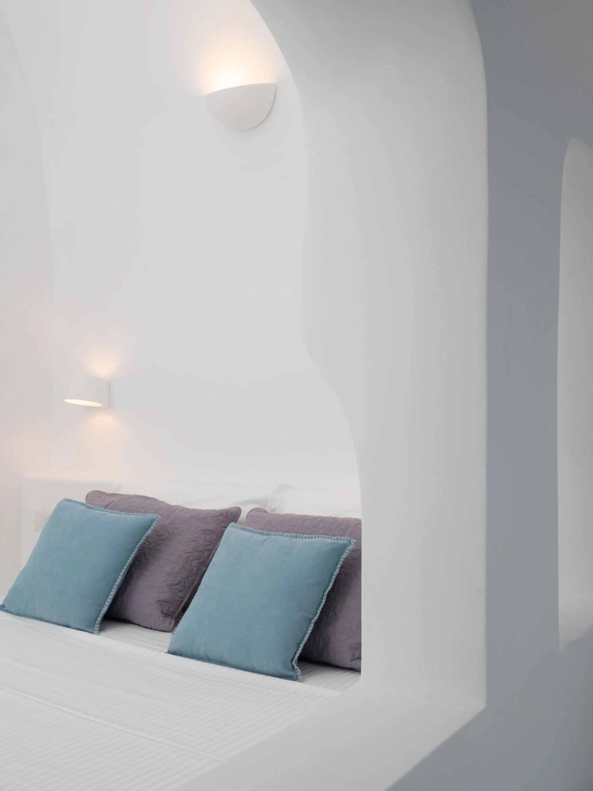 Seating area, Bed in Oia Spirit Boutique Residences