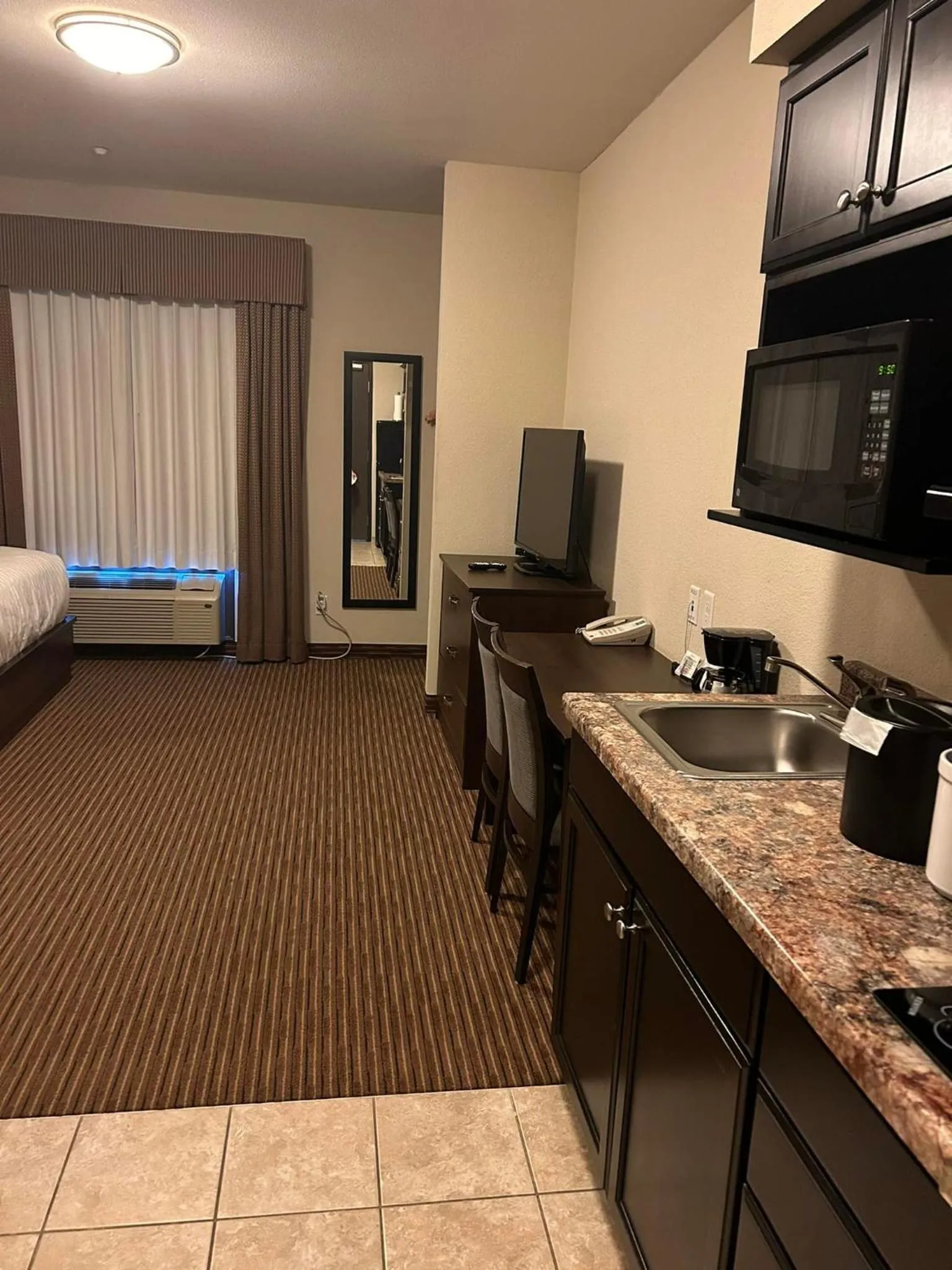 Kitchen or kitchenette in Travelodge Suites by Wyndham Estevan