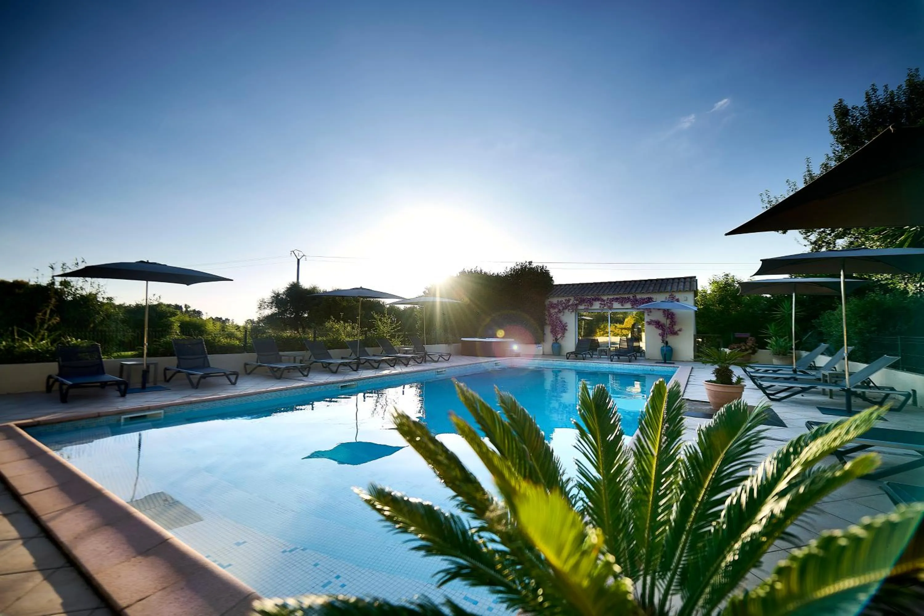 Swimming pool in Hôtel Les Jardins