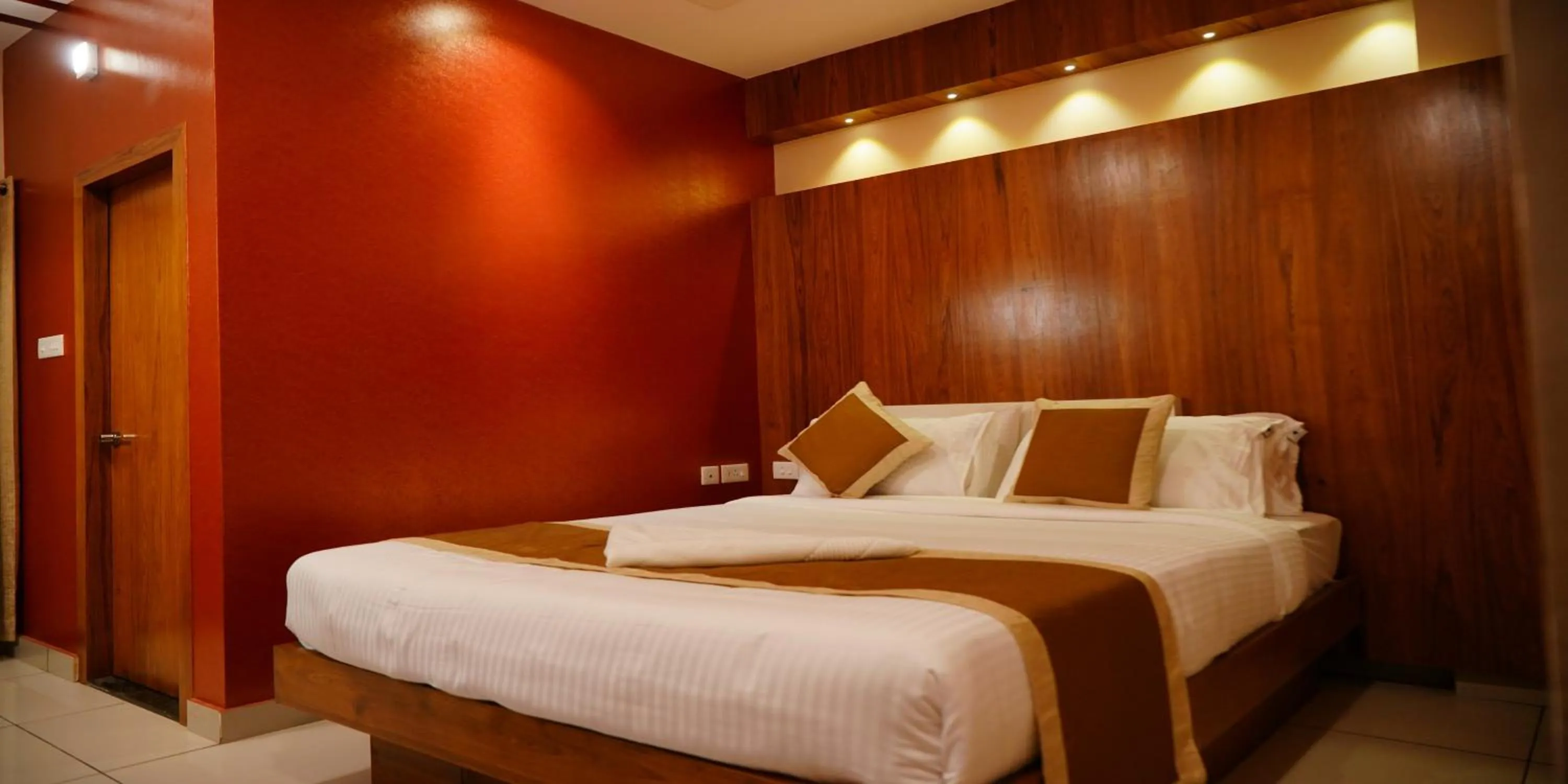 Bed in Nextel Inn, Calicut