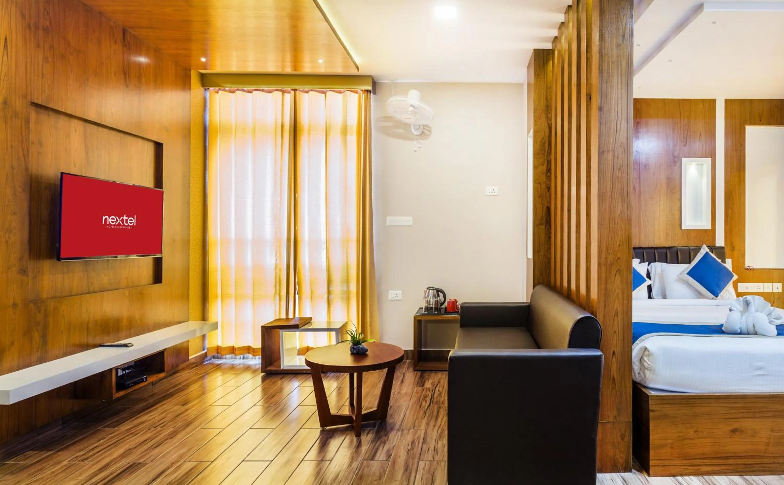 Living room, Bed in Nextel Inn, Calicut