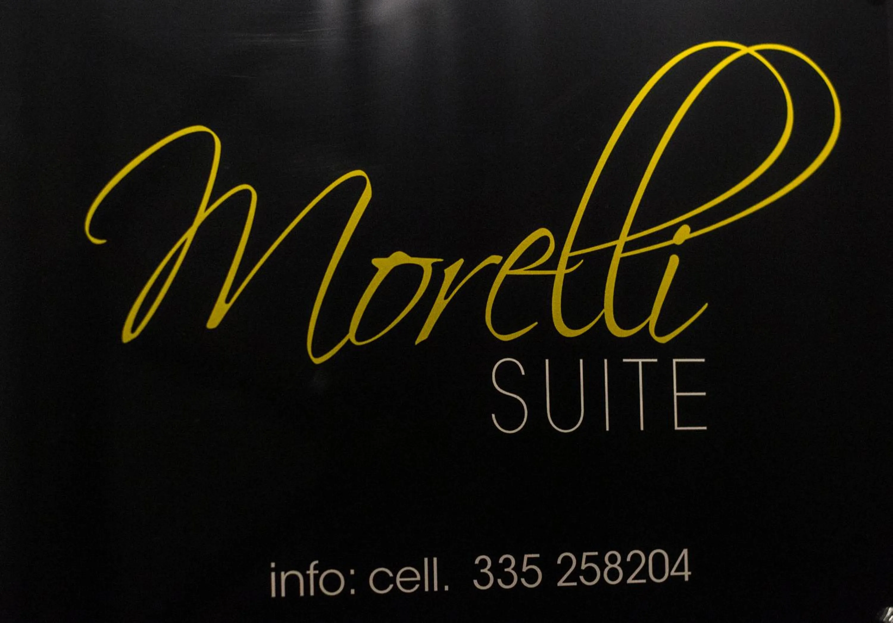 Property logo or sign in Morelli suite