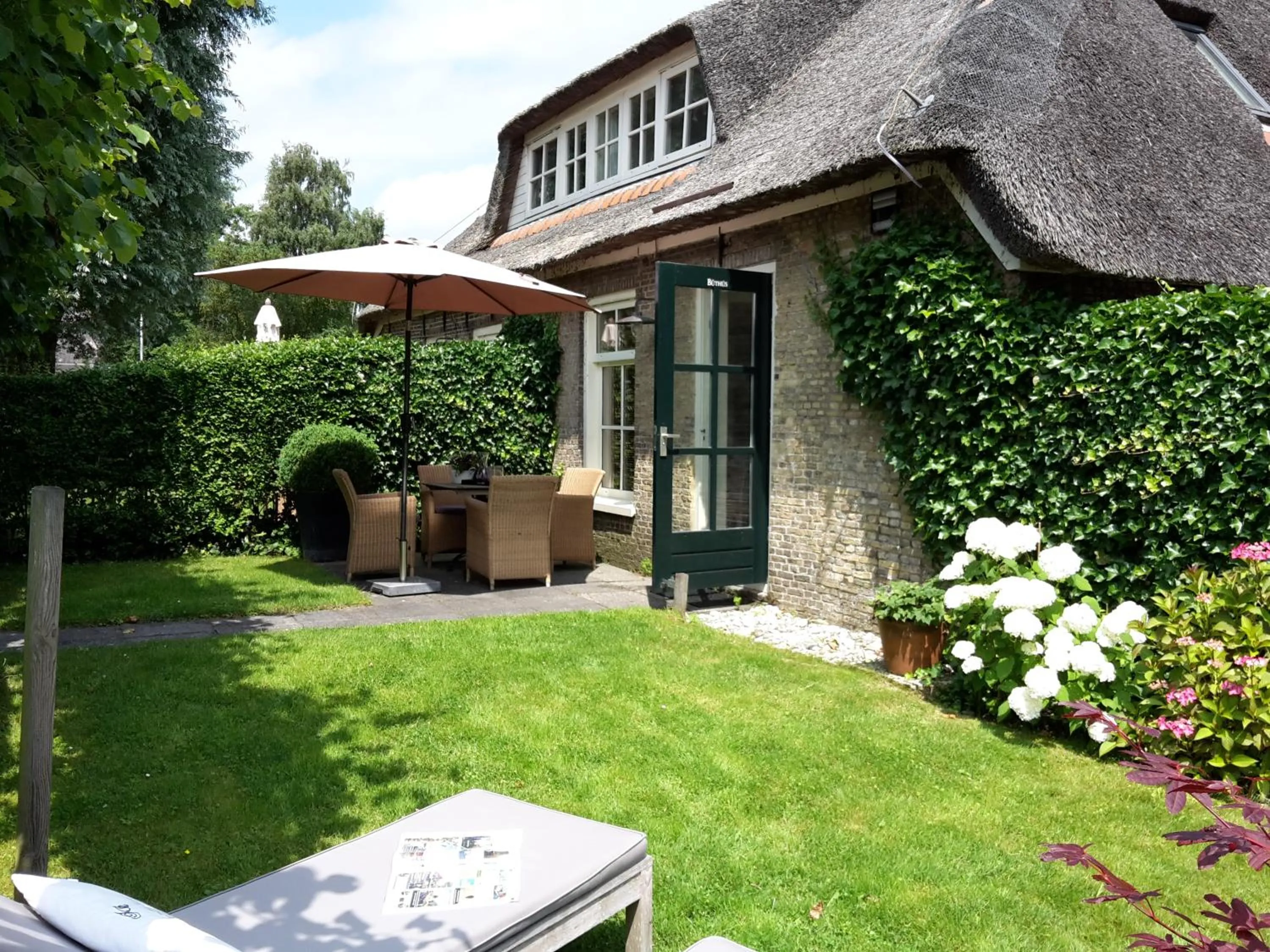 Garden in d'Oude Herbergh, vakantiehuizen aan het water