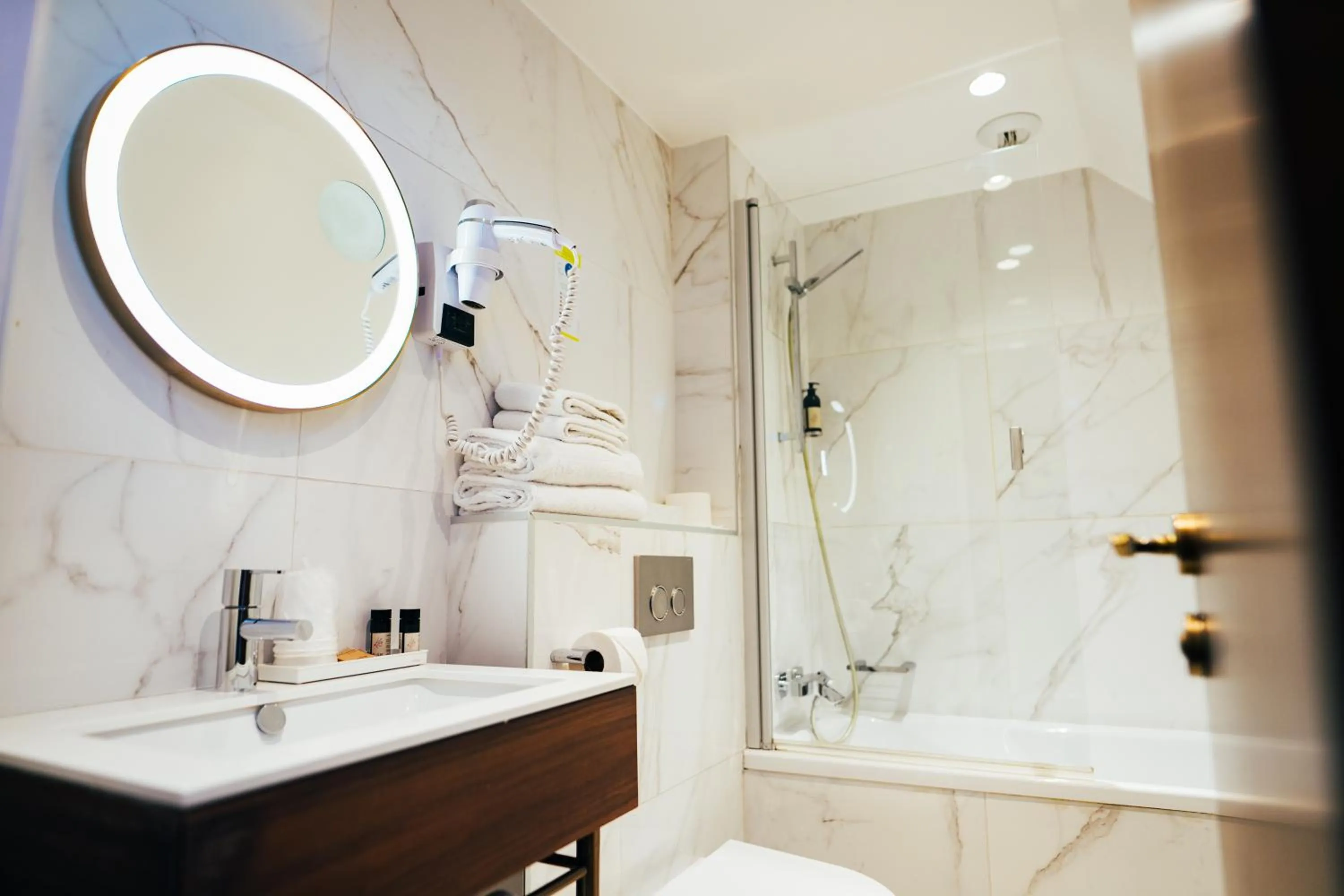 Bathroom in Hôtel du Cheval Blanc - Paris Marne La Vallée