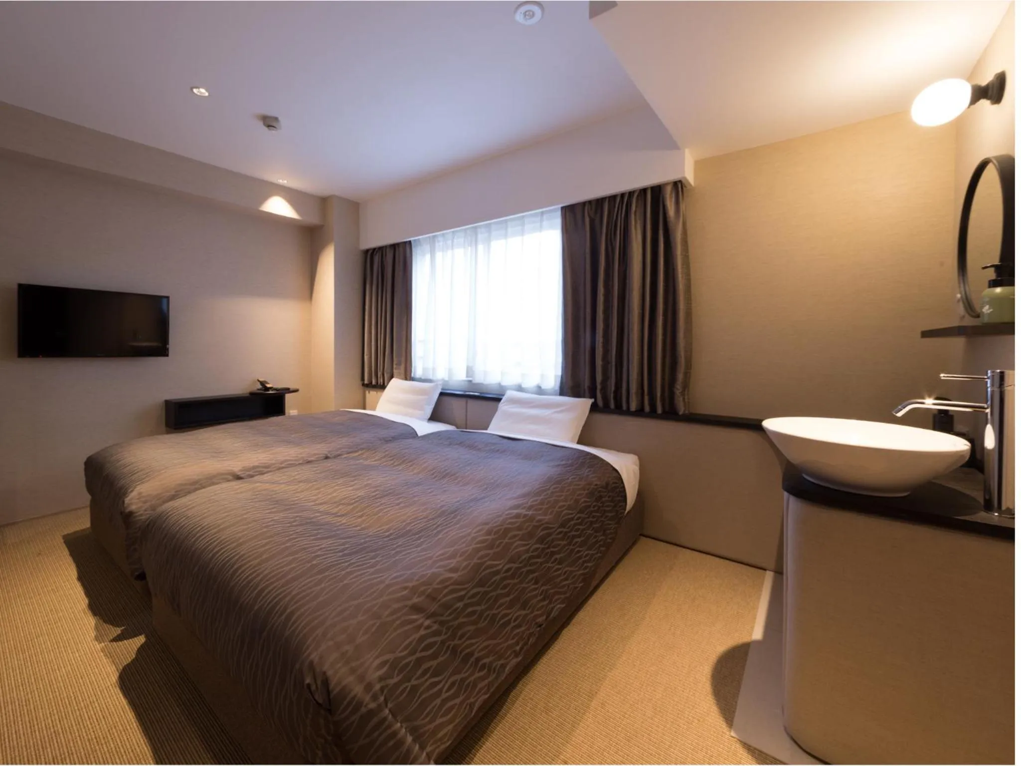 Photo of the whole room, Bed in THE HOTELS HAKATA KASANE Bayside