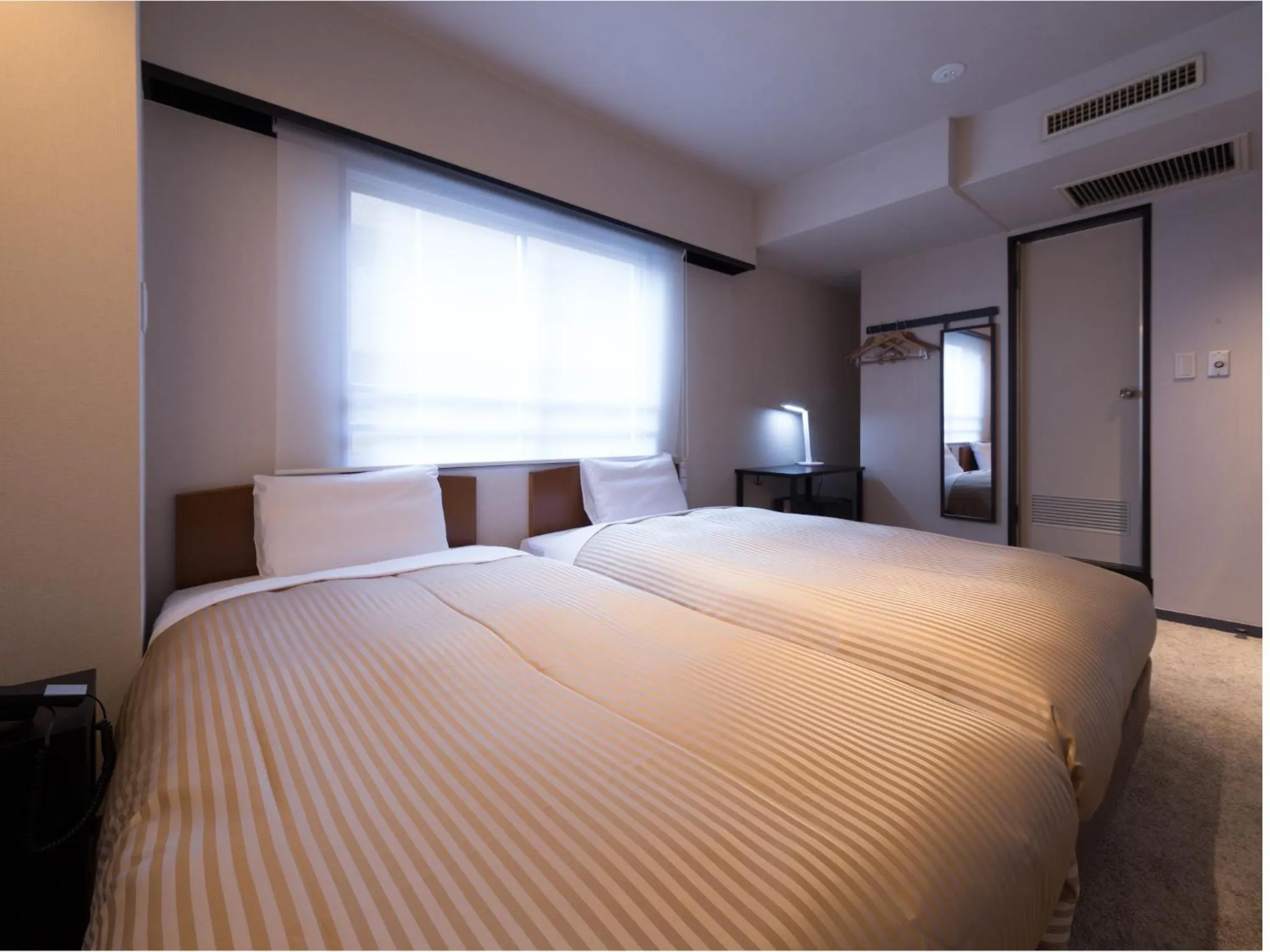 Photo of the whole room, Bed in THE HOTELS HAKATA KASANE Bayside
