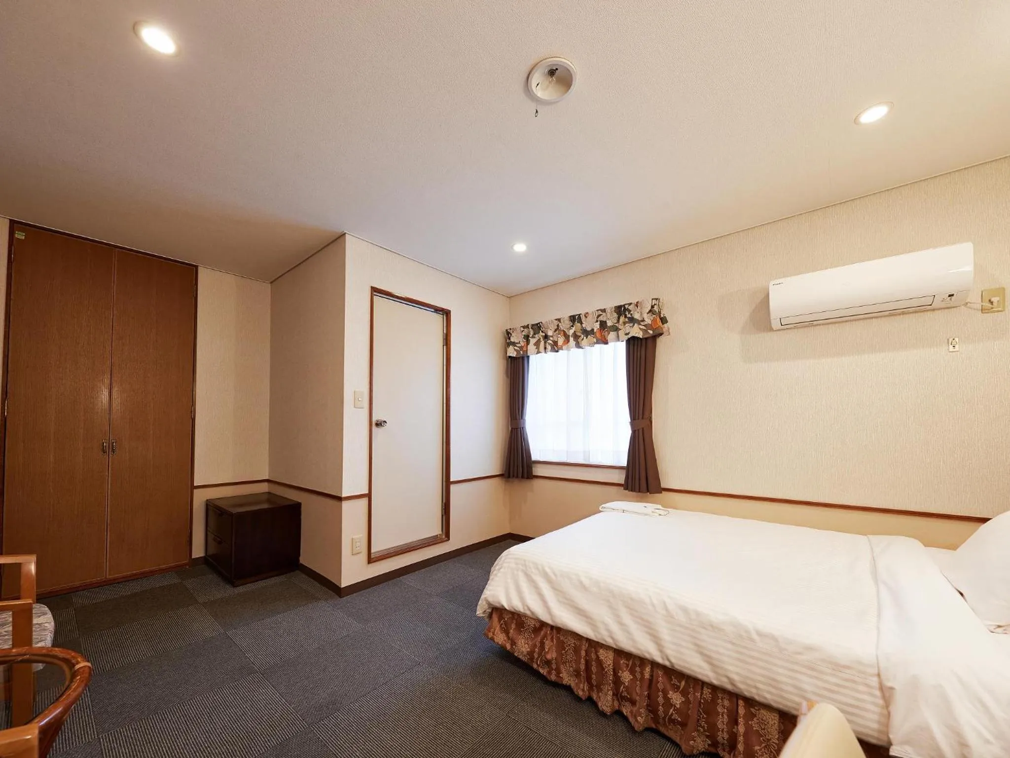 Photo of the whole room, Bed in Crown Hotel Okinawa