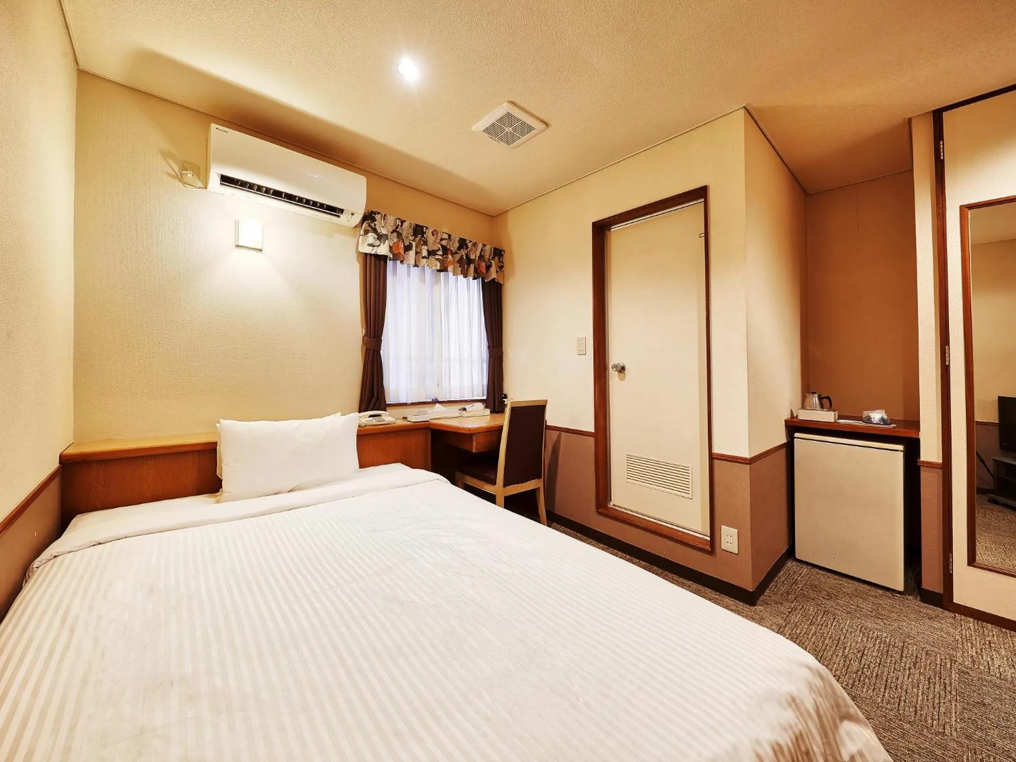 Photo of the whole room, Bed in Crown Hotel Okinawa