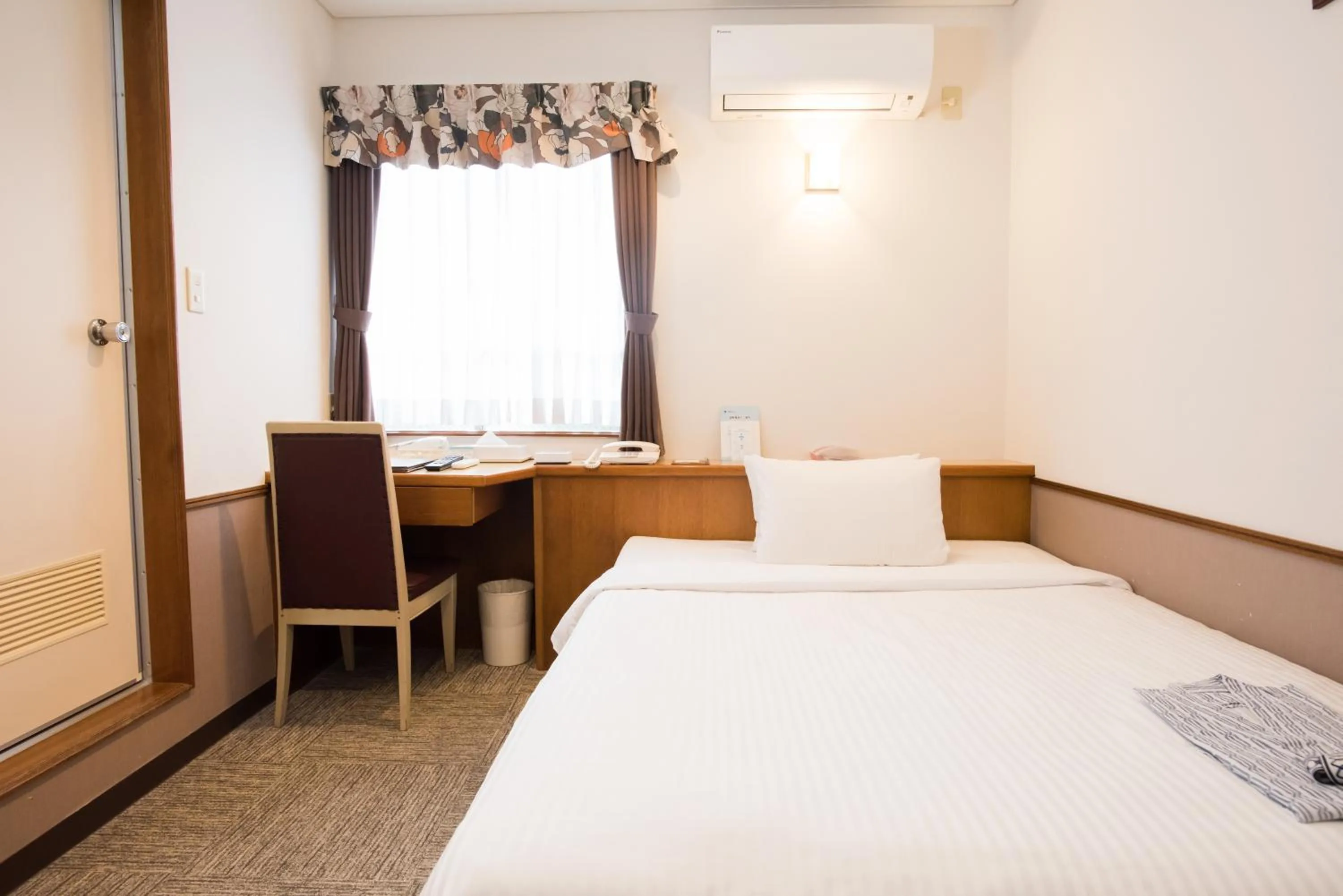 Bed in Crown Hotel Okinawa