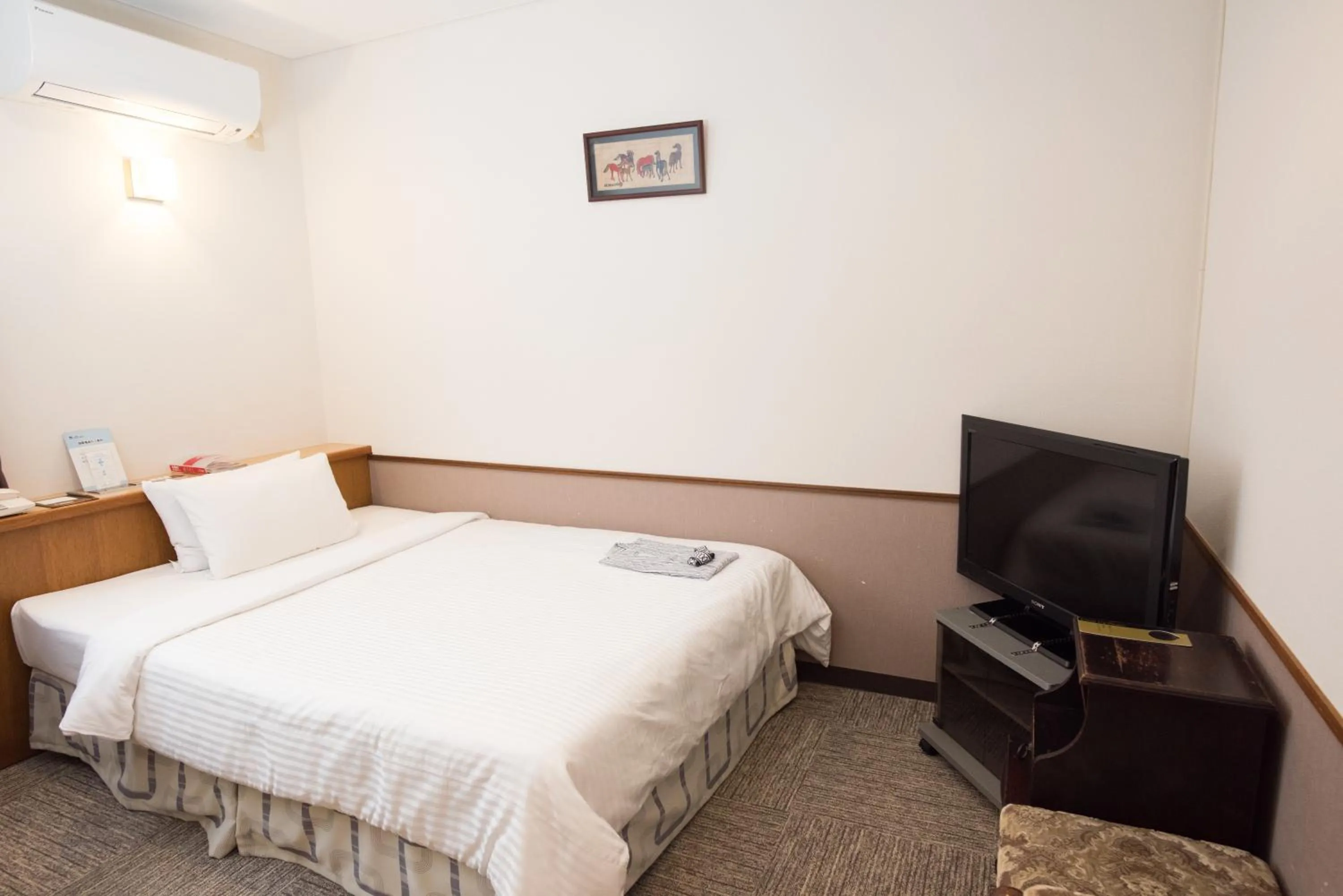 Bed in Crown Hotel Okinawa