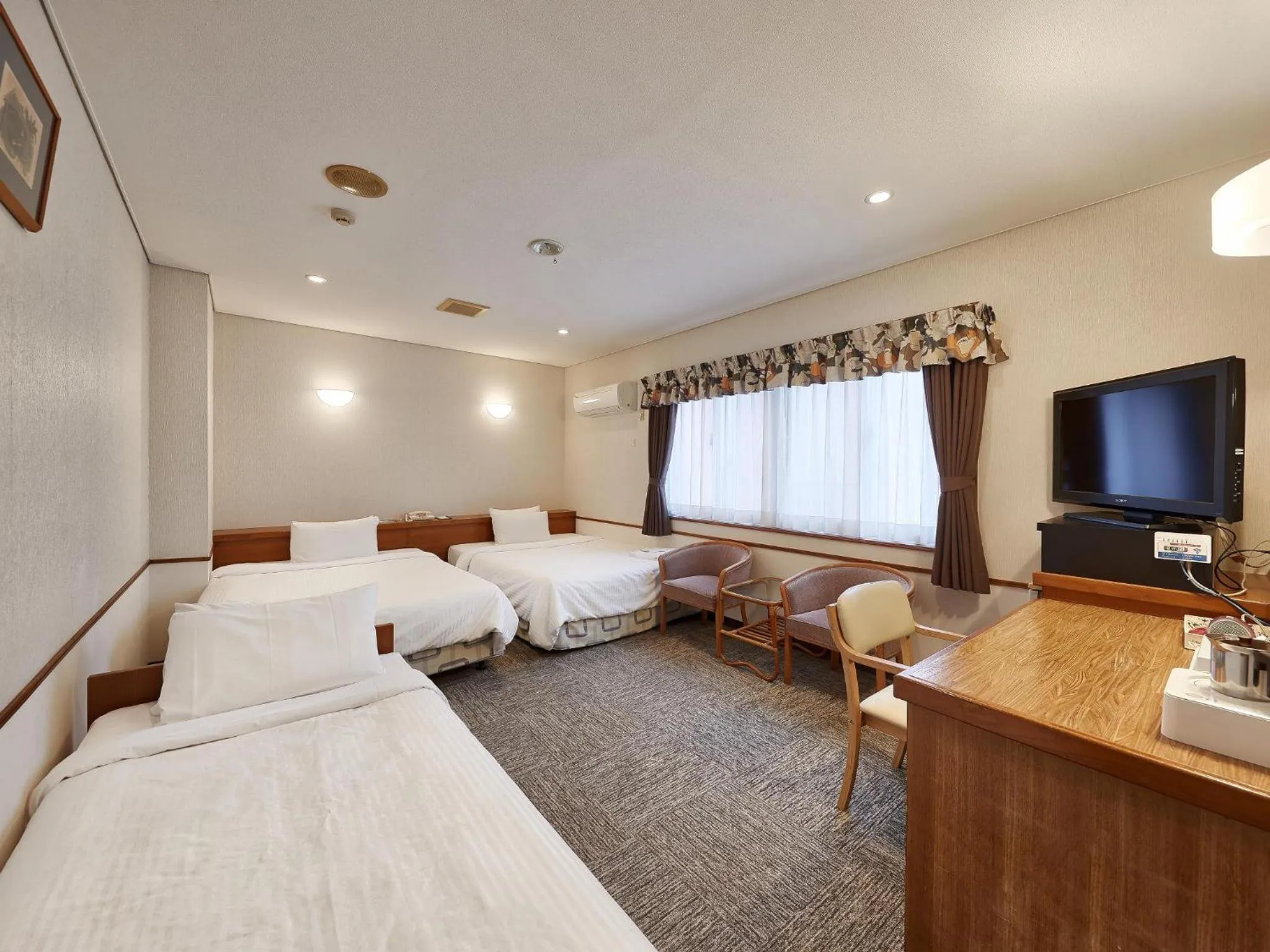 TV and multimedia, Bed in Crown Hotel Okinawa