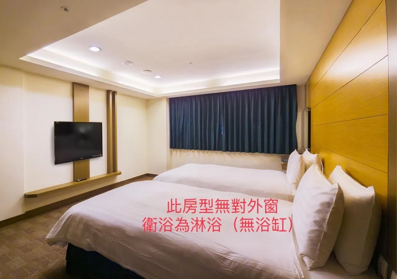 Bed in Cheng Wan Grand Hotel