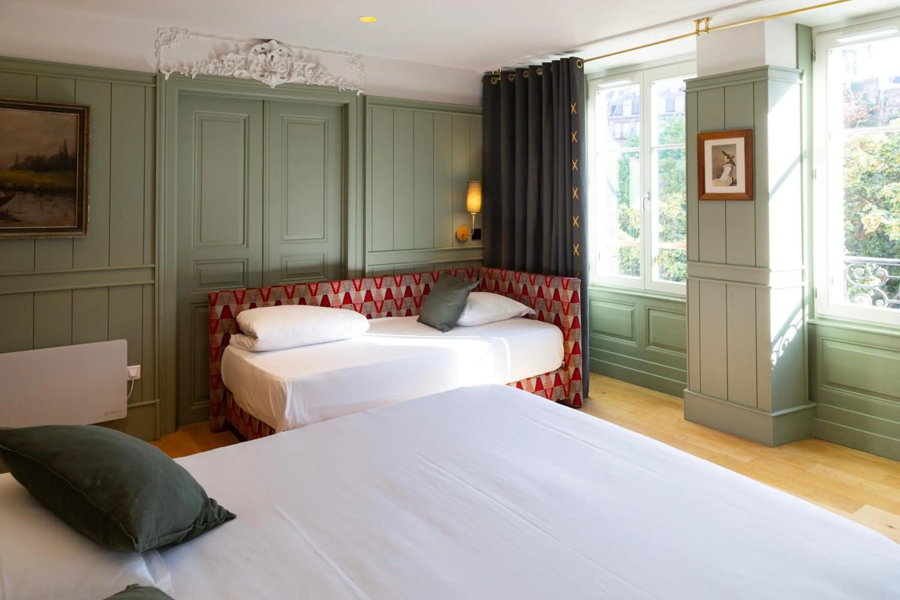 Bed in Le Kléber Hôtel