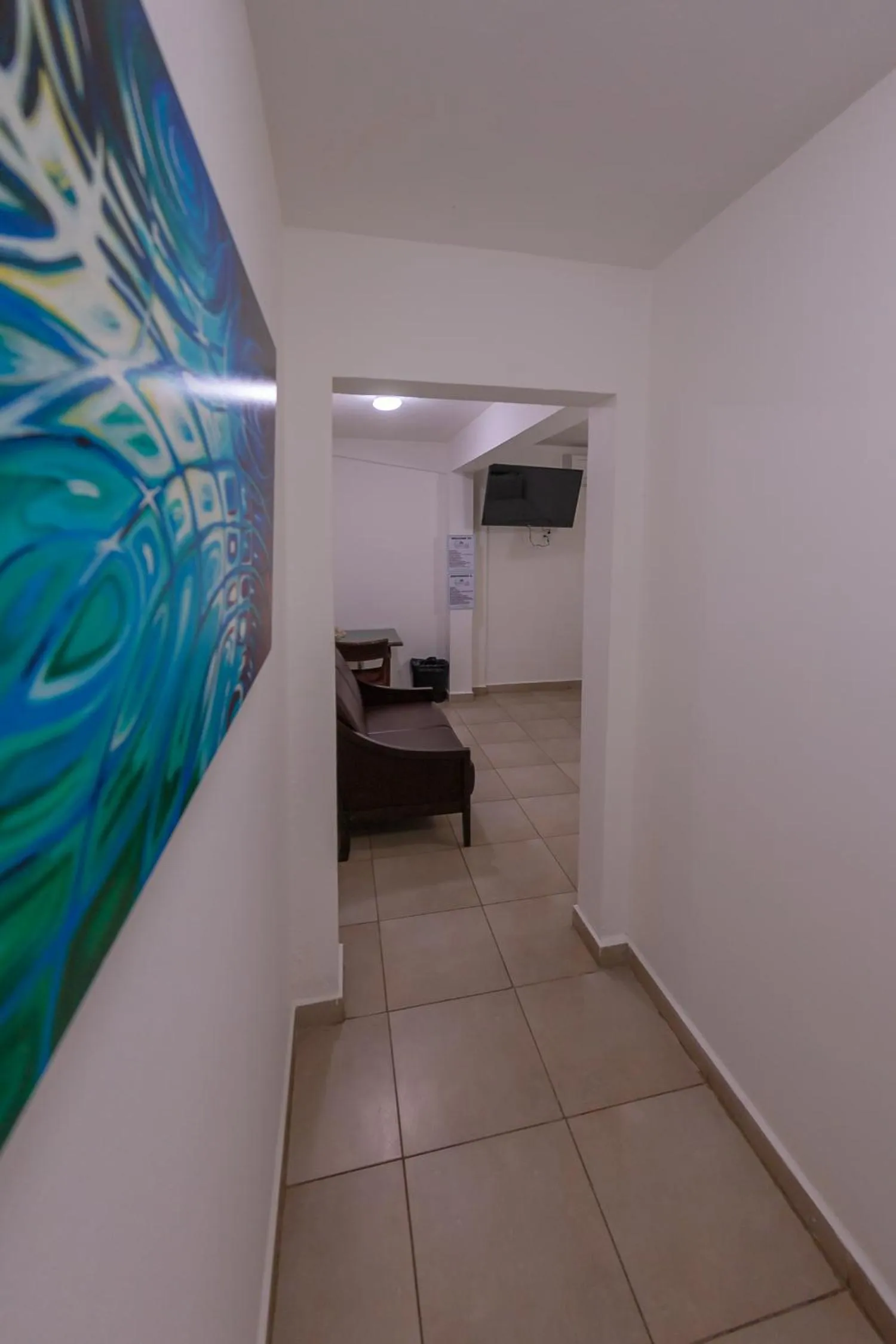 TV and multimedia in Casa Verde Hotel - Steps to the Beach, Pool, Restaurant & Bar