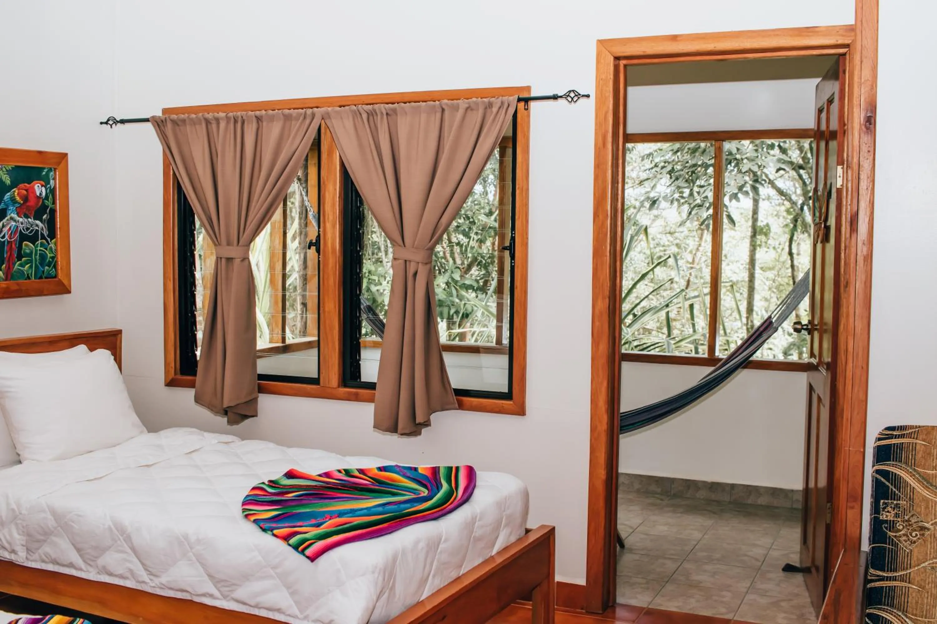 Bed in Mariposa Jungle Lodge