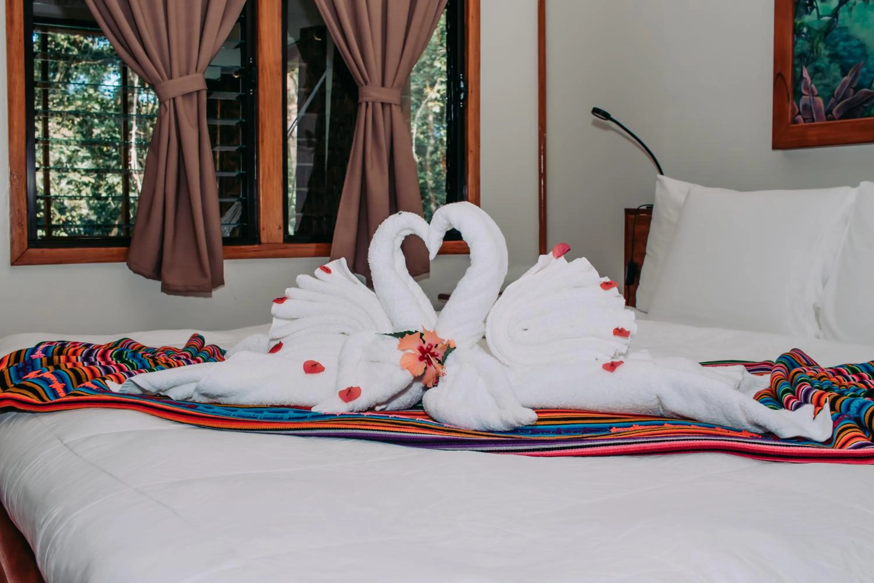 Bed in Mariposa Jungle Lodge