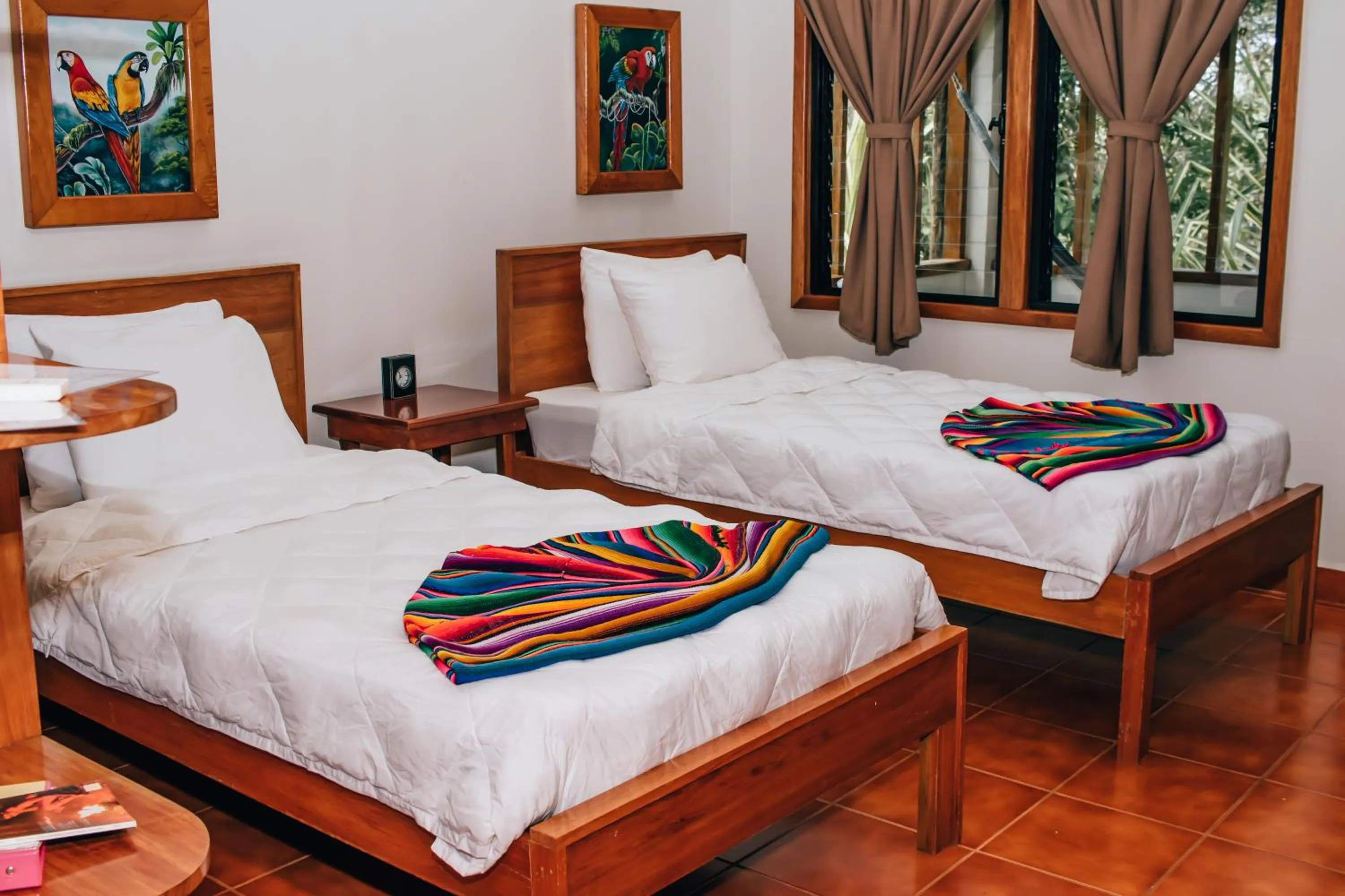 Bed in Mariposa Jungle Lodge