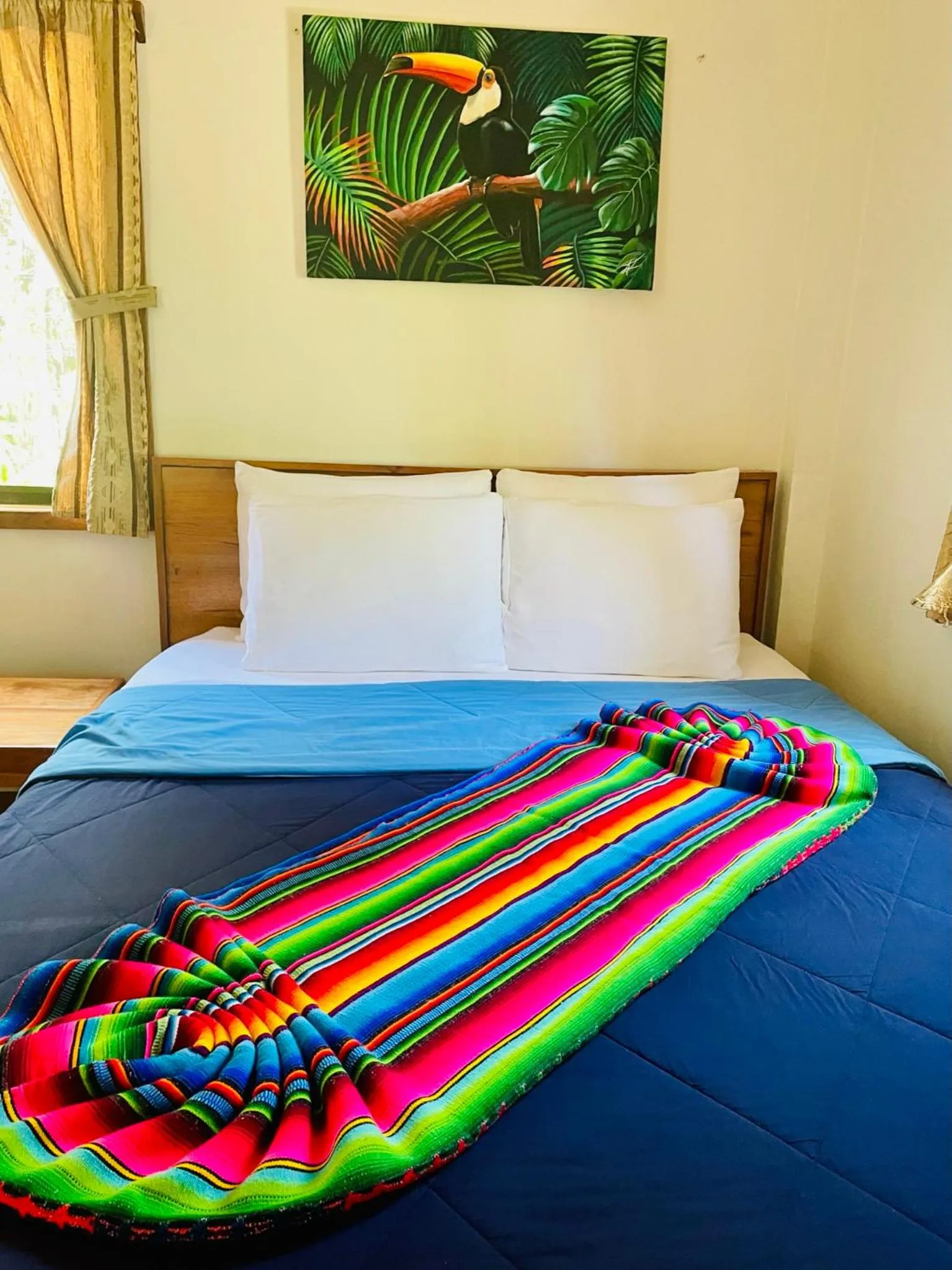 Bed in Mariposa Jungle Lodge