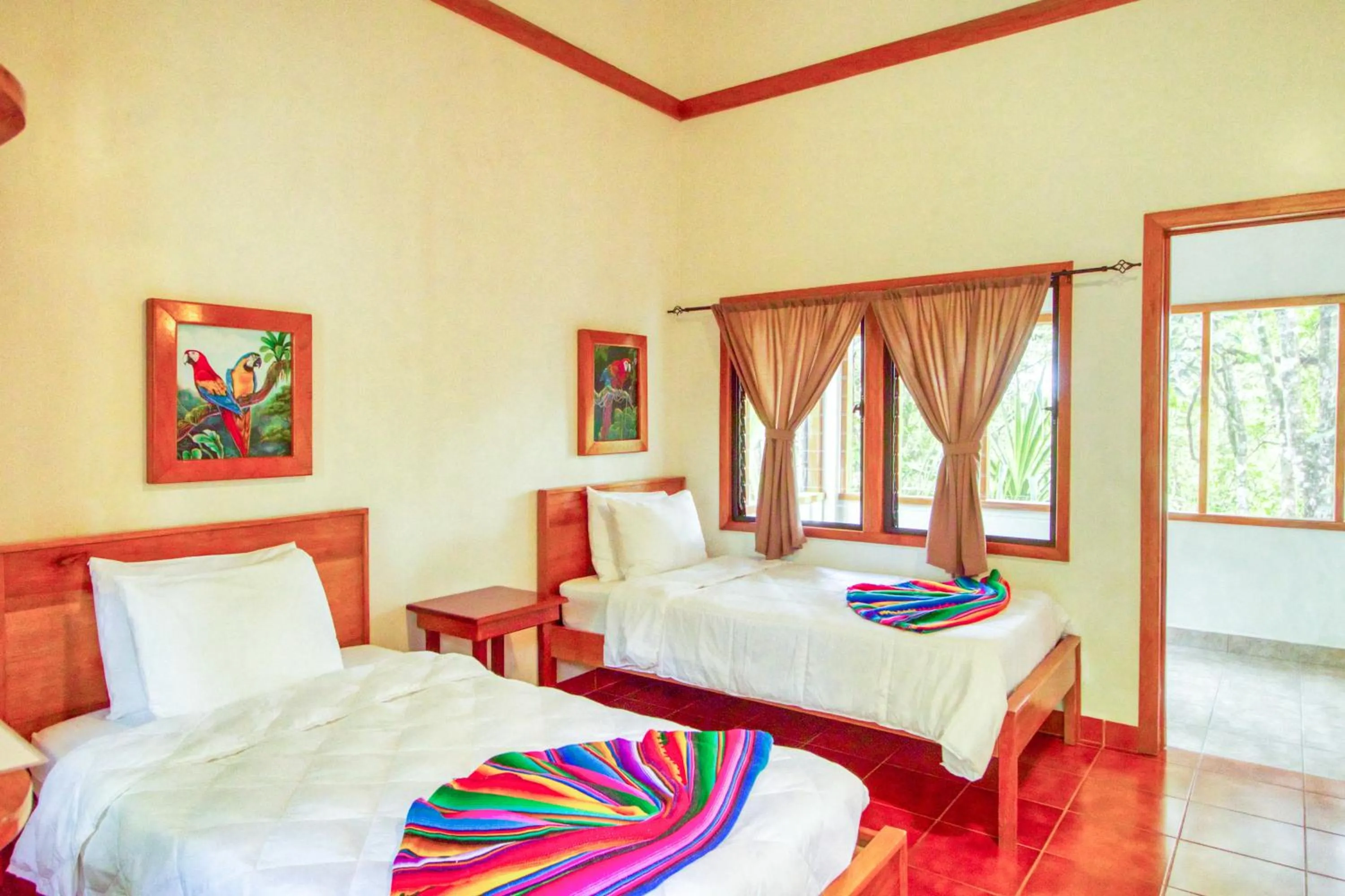 Bed in Mariposa Jungle Lodge